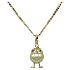 Ciondolo pulcino in oro 18Kt con perla dei Mari del Sud e diamanti