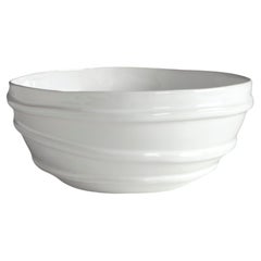 white ceramic bowl decorated with three lines in relief