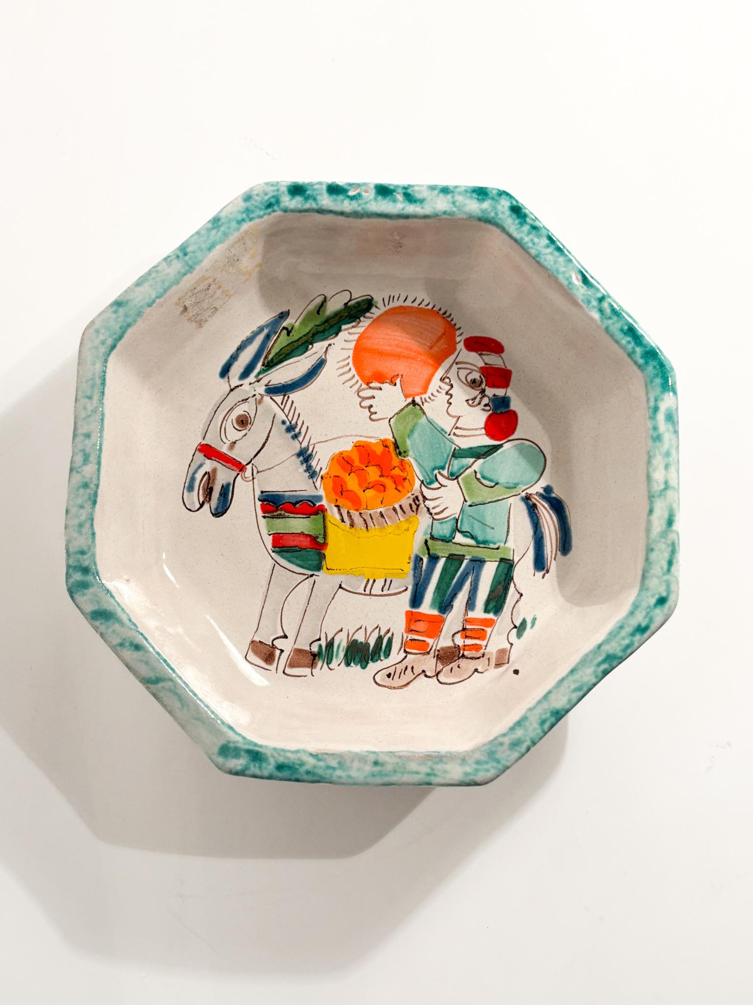 Ciotola in Ceramica di Giovanni De Simone dipinta a mano, realizzata negli anni '70

Ø cm 22 h cm 5

Le Ceramiche De Simone rappresentano un'eccellenza dell'artigianato siciliano, con una storia che affonda le radici nella tradizione ceramica