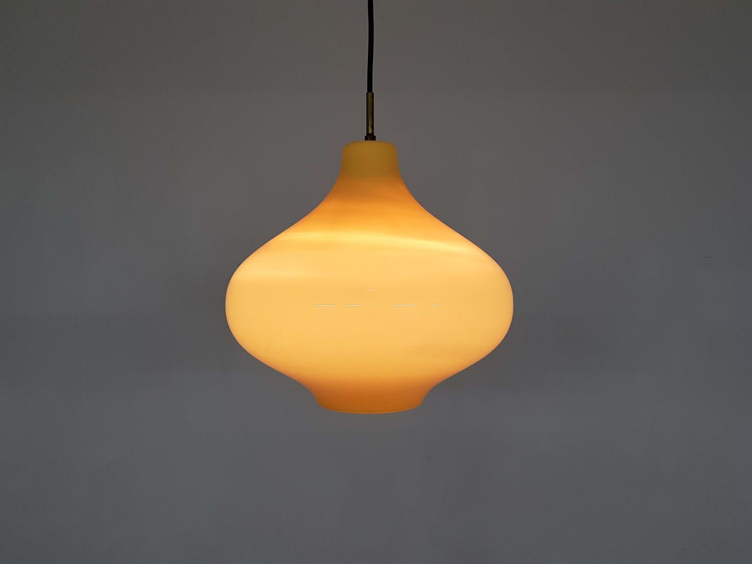 Amazing yellow handblown pendant light by Italian designer Massimo Vignelli for Venini Murano.

In the midcentury, the most beautiful glass probably came from Italy, Murano. It was in Murano where they developed glass making like an art. Many