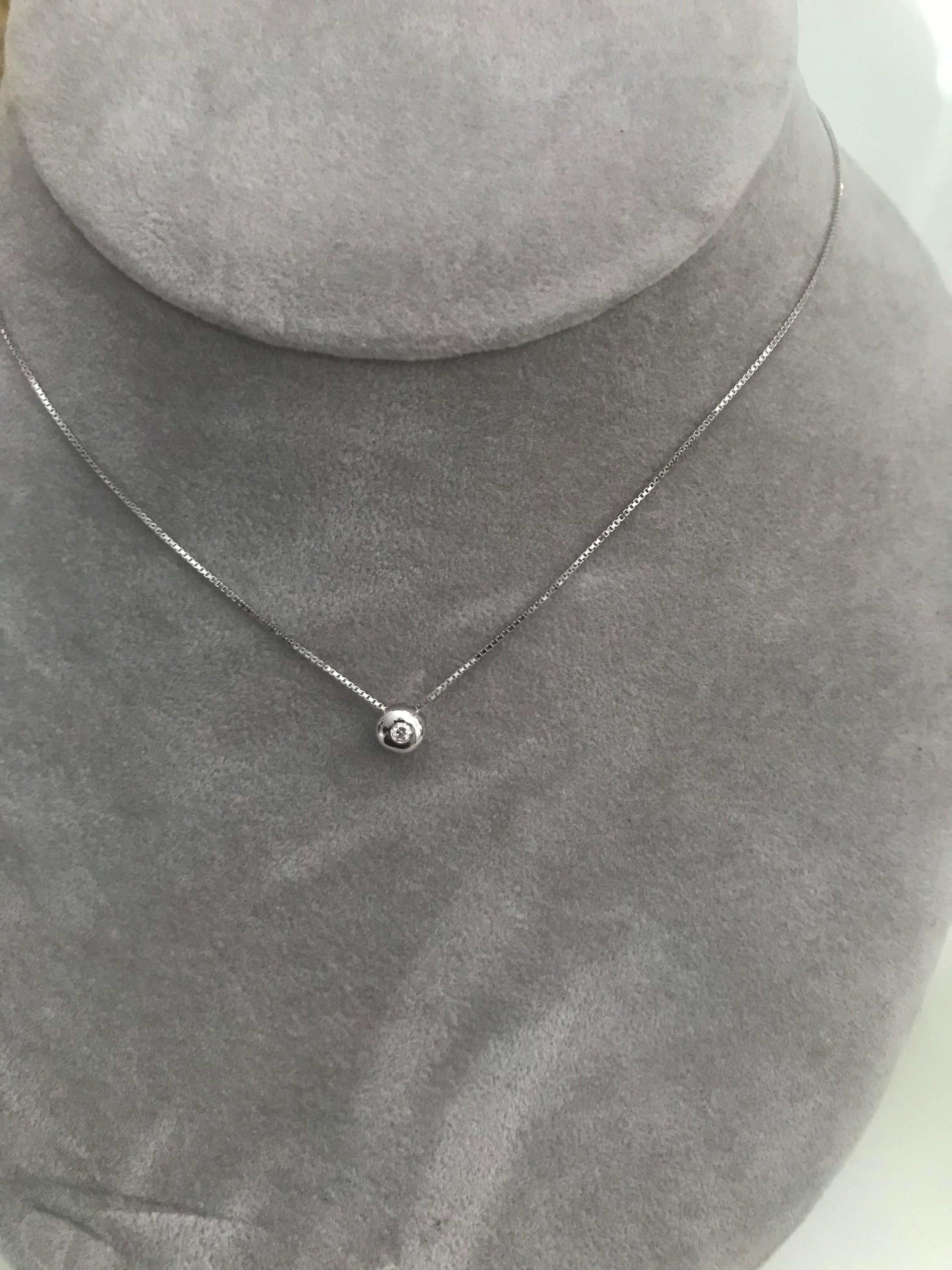 Further Details 
0.03ct White Diamond Internally Flawless F in colour
2,50g of Handcast White 18kt Gold with 80cm Venetian Box White Gold Chain
We are able to set bigger stones in this setting as well, please contact Gabriella for a list of