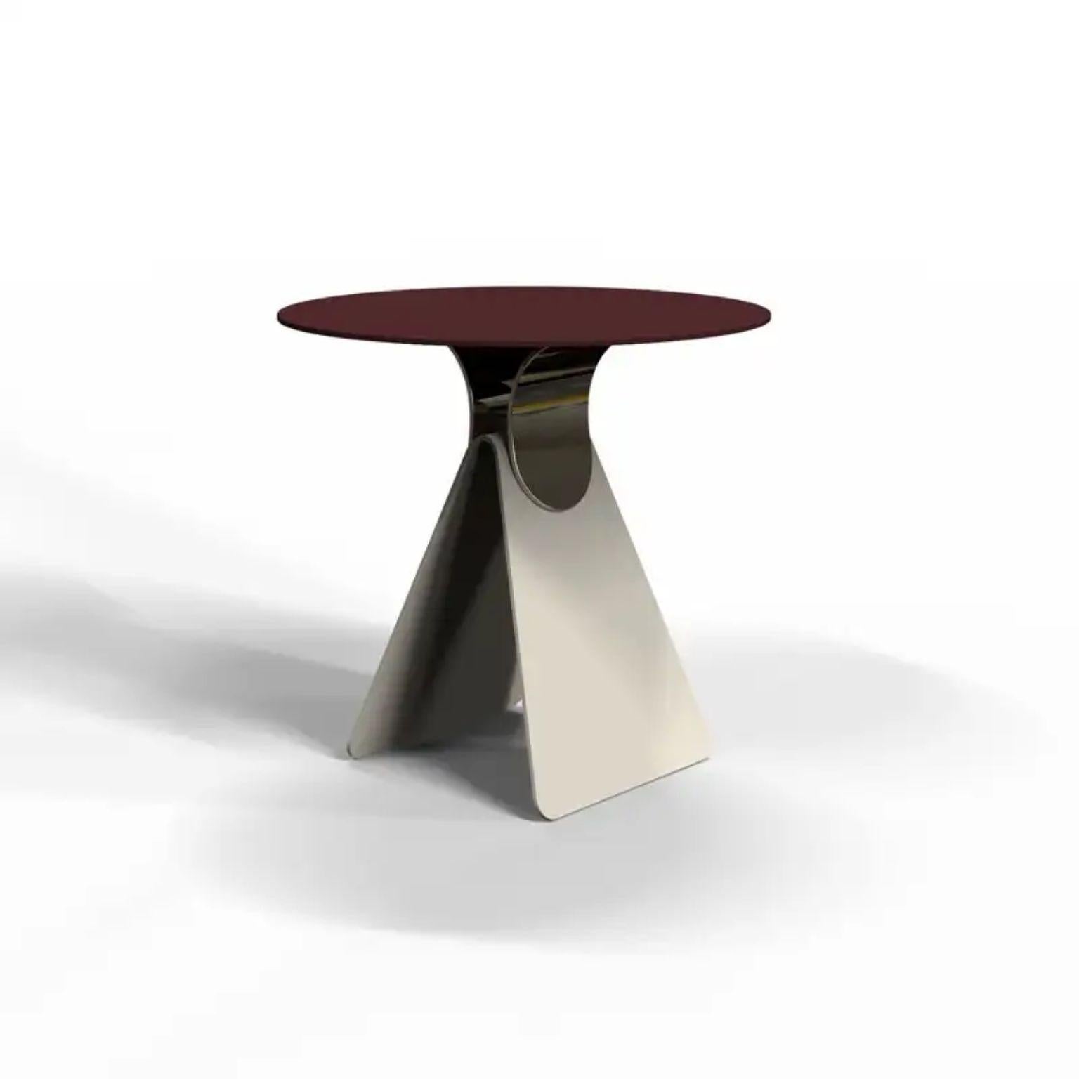 Cipputi Burgundy Coffee Table by Mason Editions
Designed by Quaglio Simonelli.
Dimensions: Ø 50 cm x H 48 cm.
Materials: metal.

Available in different colors. 

Cipputi is a side table designed by metal sheets that fold and assemble to
