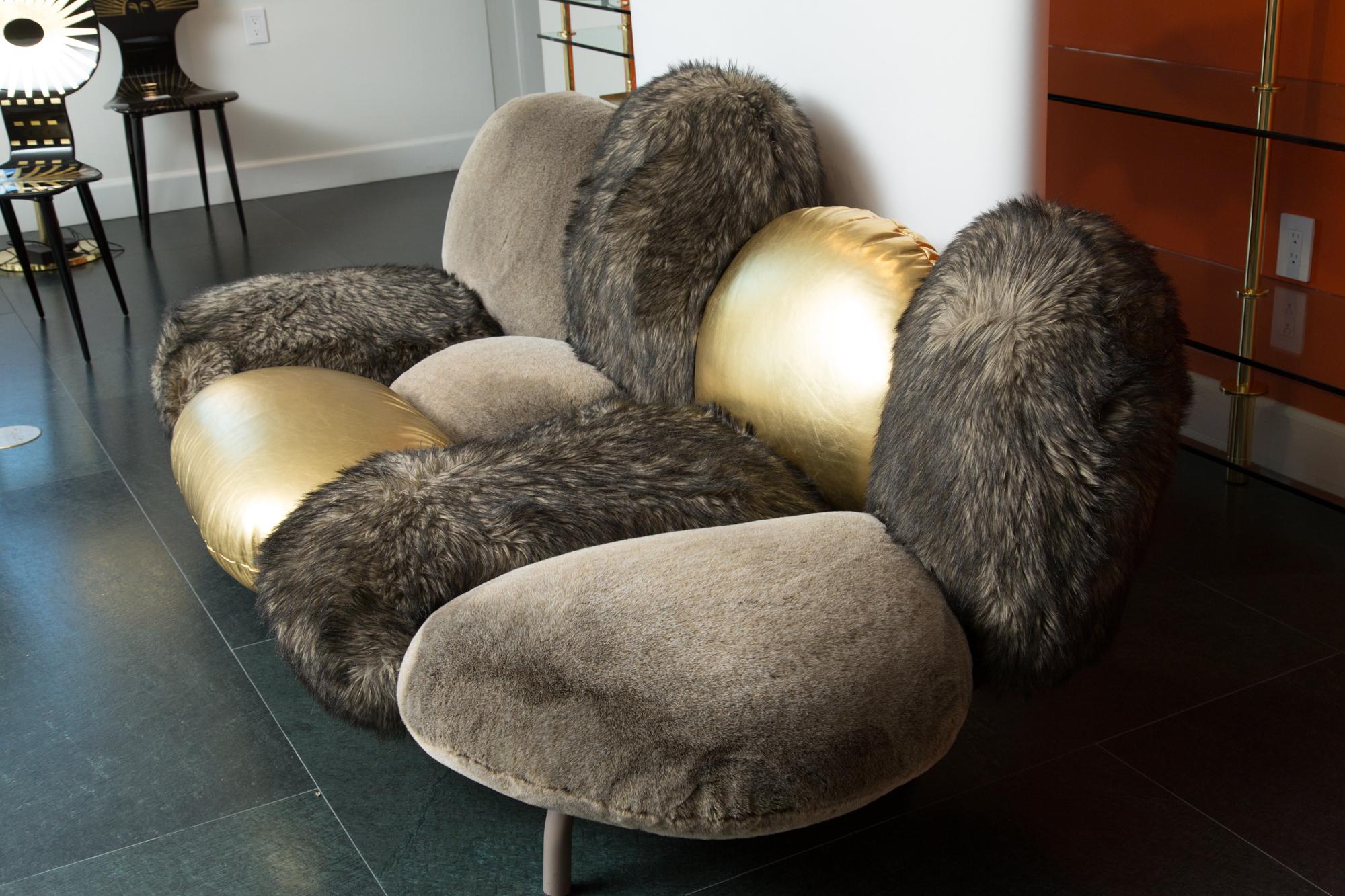 The Cipria sofa is a deliberately iconic piece. The settee has 9 cushions fixed to an invisible metal tube frame. The stuffing is Gellyfoam and Dacron wadding. The ecological fur covering comes in different hair lengths to produce variations on the