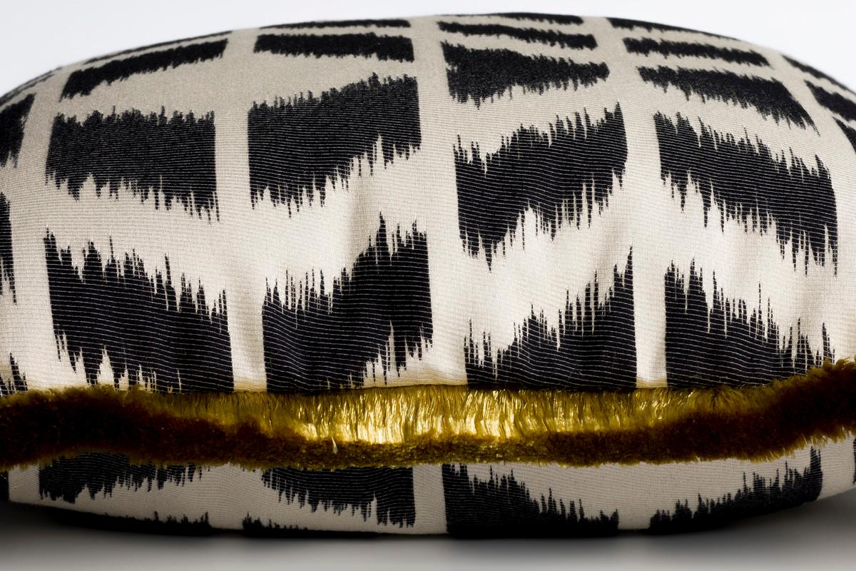 Cipriano zebra black and white Ikat style cushion/pillow: A play on the traditional Ikat, this fabric is a stunning decorative textile. This cushion with the beautiful yellow silk trimming has an ethnic feel to it. All fabfabrics cushions are