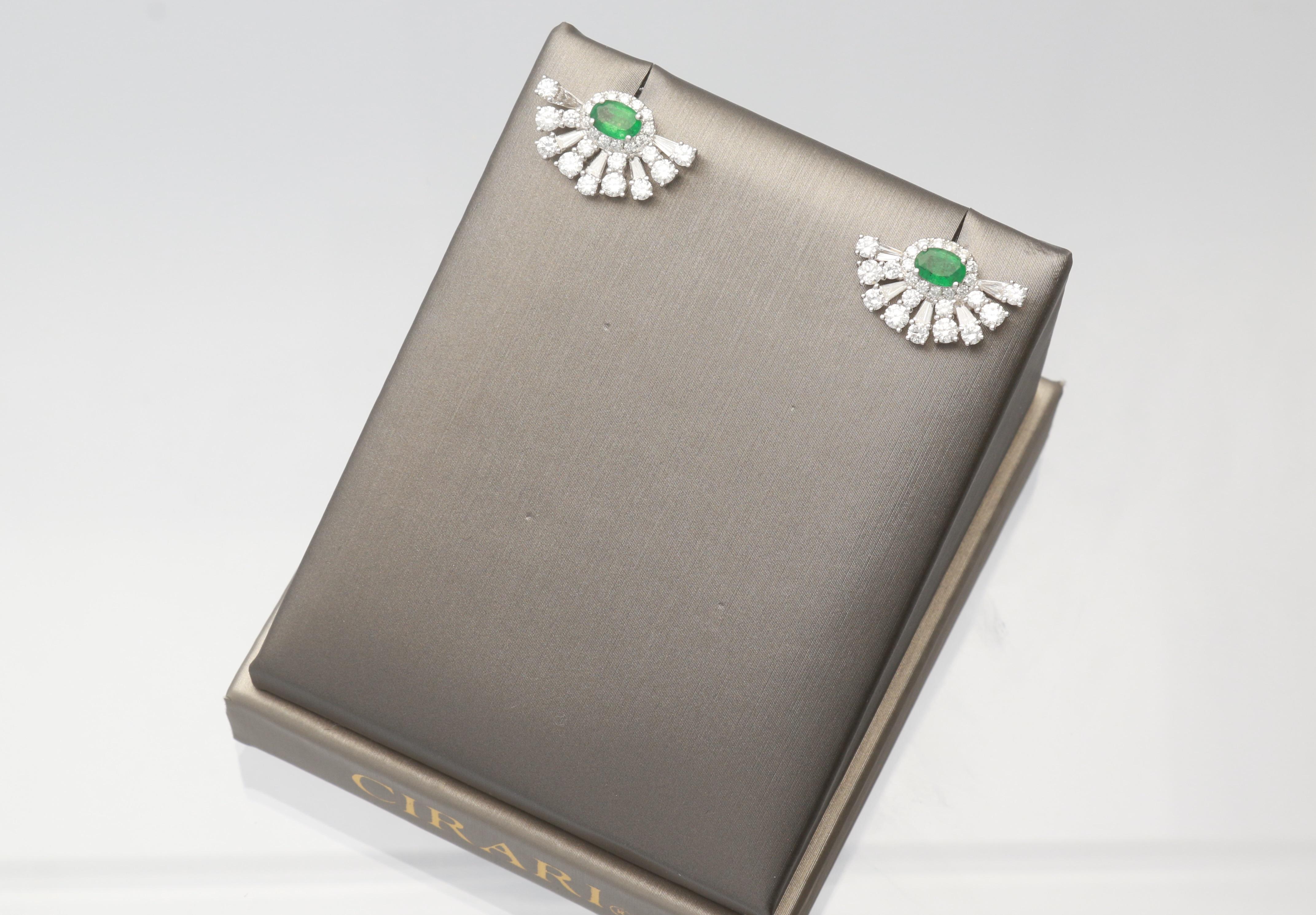 This one of a kind Gin and Grace Earring is crafted in 18-karat White Gold and features 2 oval cut Emeralds 0.86 Carat, 10 Baguette Diamond 0.48 Carat, 8 Round Brilliant cut Diamonds 0.68 Carat  & 44 Round Brilliant cut Diamond 1.10 Carat. This
