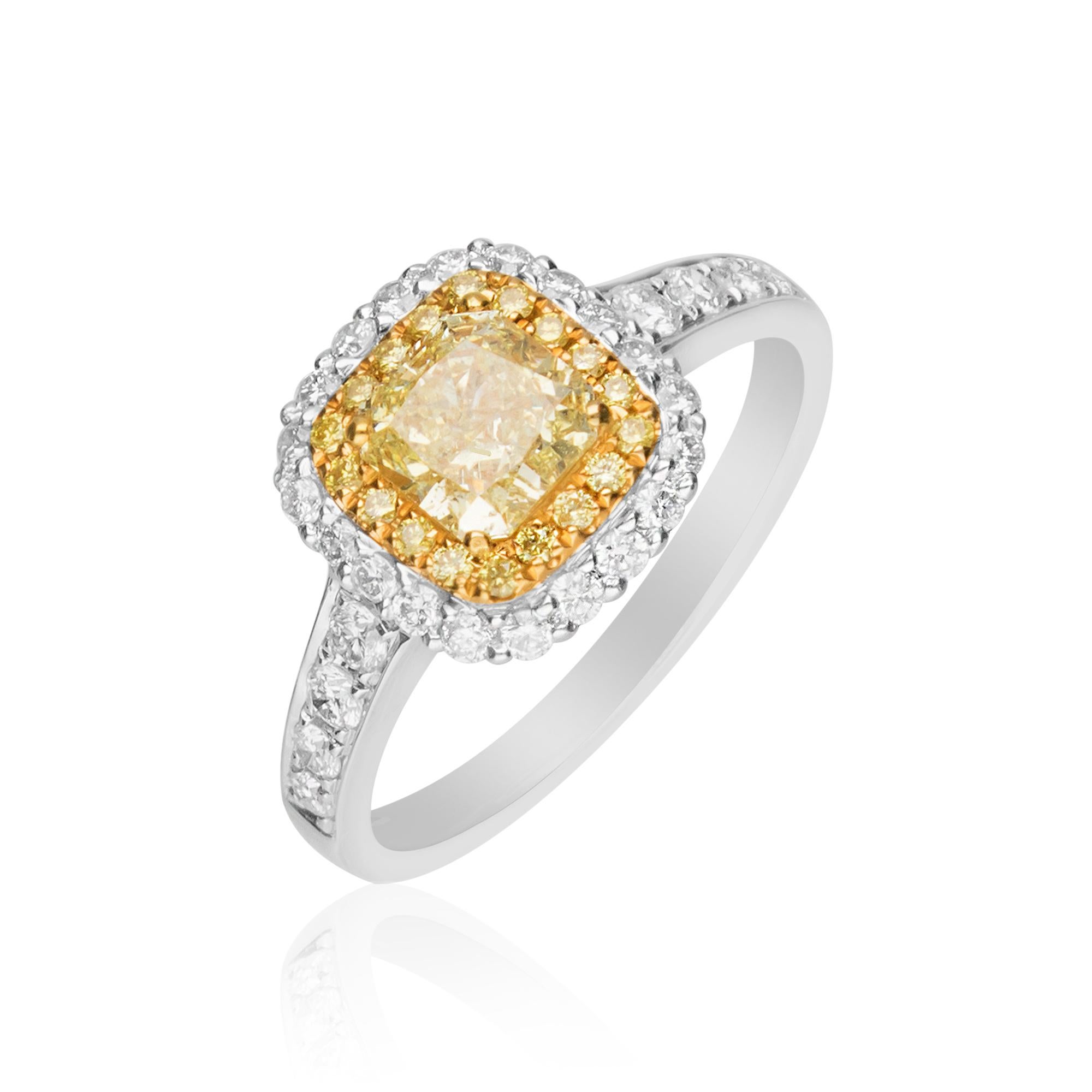 Featuring this beautiful Engagement ring, crafted in 18-karat Two Tone gold. It features a 1 Carat cushion cut Yellow Diamond surrounded by 18 yellow Diamonds 0.11 Carat & 28 Round Diamonds 0.47 Carat. 
This ring comes in size 7 and can be resized