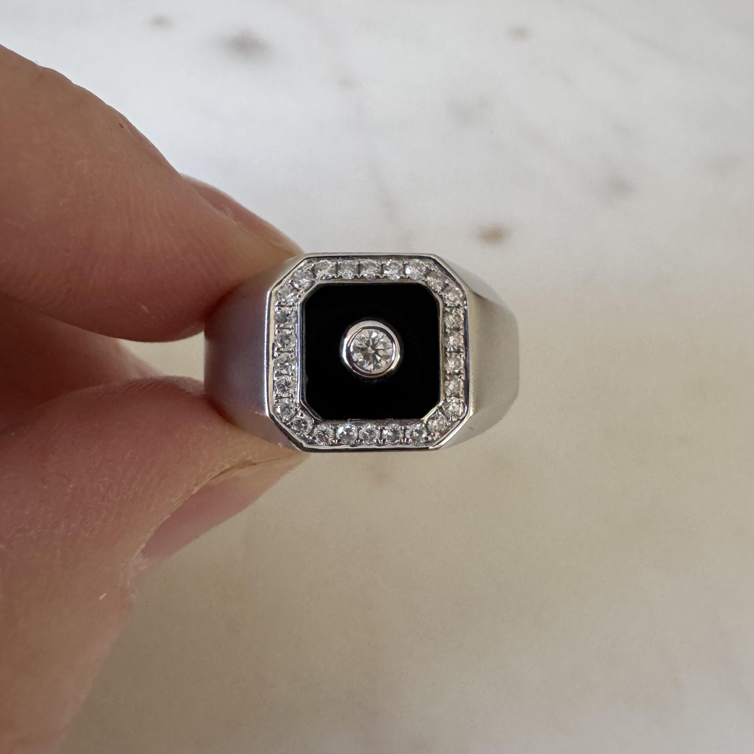 Condition:  Excellent Condition, Professionally Cleaned and Polished
Metal:  14k Gold (Marked, and Professionally Tested)
Weight:  9.4g
Gemstone:  1.27ct Onyx
Diamonds:  Round Cut Natural Diamonds 0.32cttw
Width:  12.5mm at face, 4.5mm at back
Size: