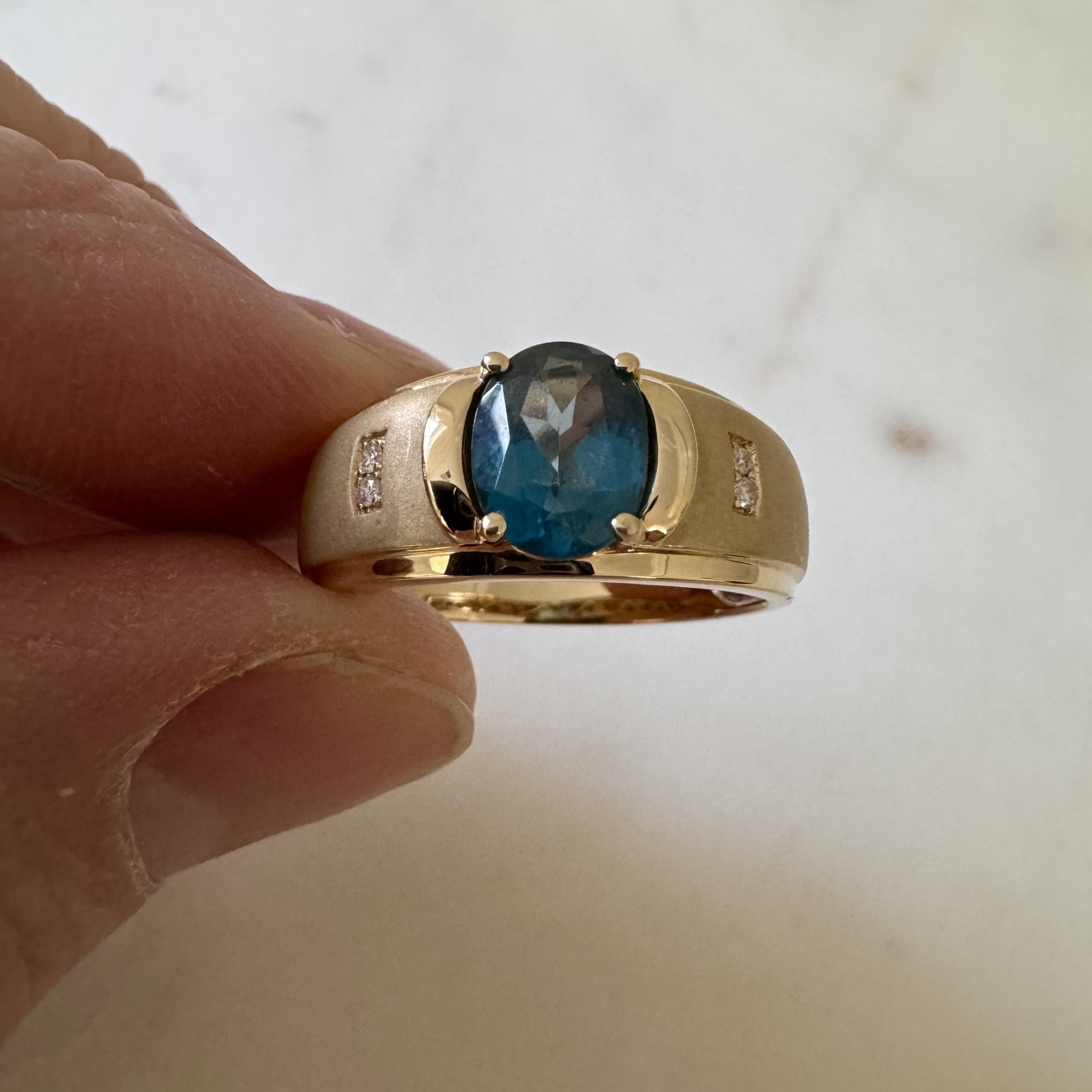 Condition:  Excellent Condition, Professionally Cleaned and Polished
Metal:  14k Gold (Marked, and Professionally Tested)
Weight:  6.5g
Gemstone:  9mm by 7mm London Blue Topaz
Diamonds:  Round Cut Natural Diamonds 0.04cttw 
Width:  9.5mm at face,