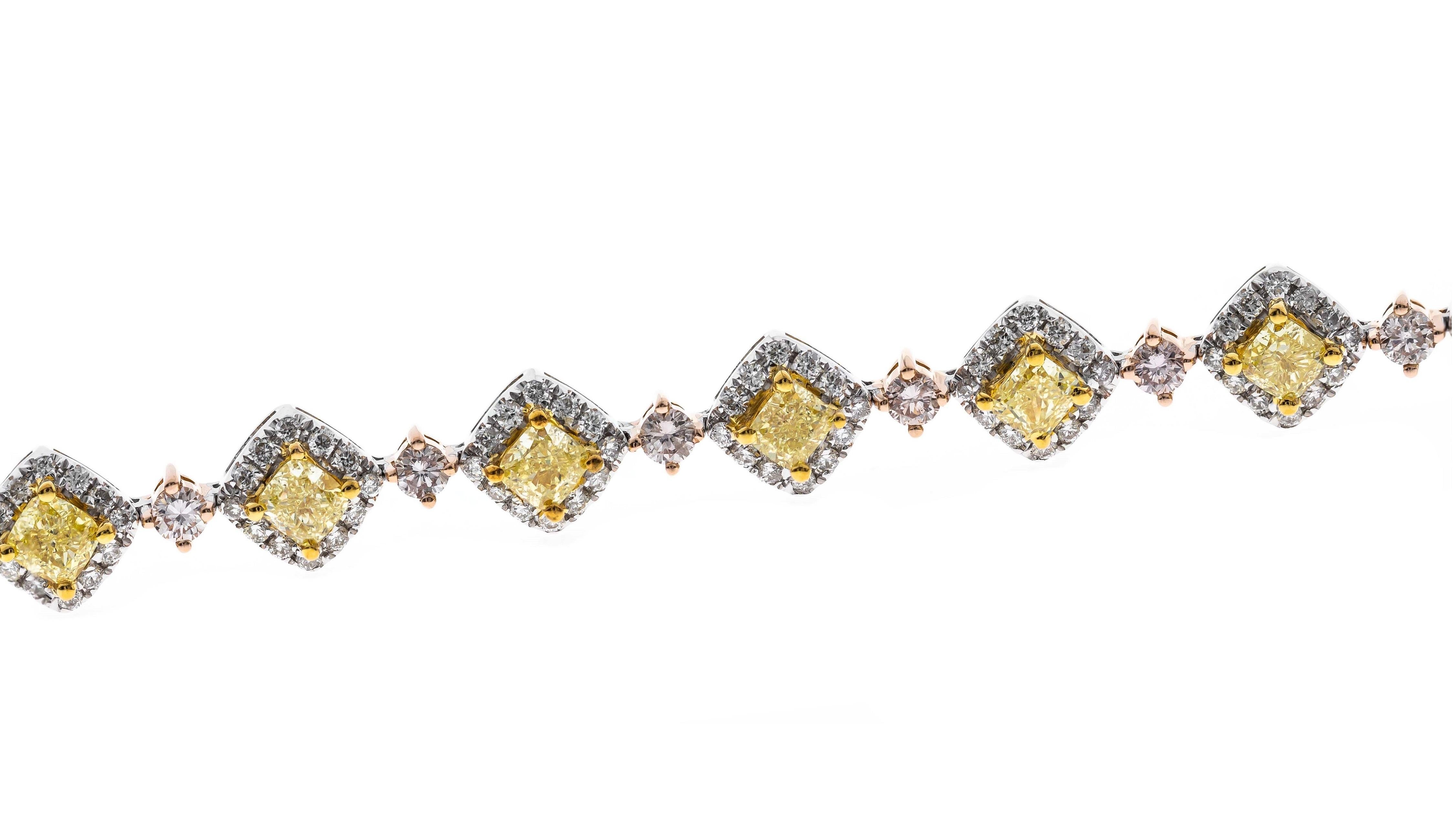 This one of a kind diamond bracelet is crafted in 18-karat Three Tone Gold and features below diamonds.
18 Fancy cushion cut Yellow Diamonds 2.90 Carat
18 Round Brilliant cut Pink Diamonds 0.95 Carat 
216 Round Brilliant cut Diamond 1.34 Carat
This