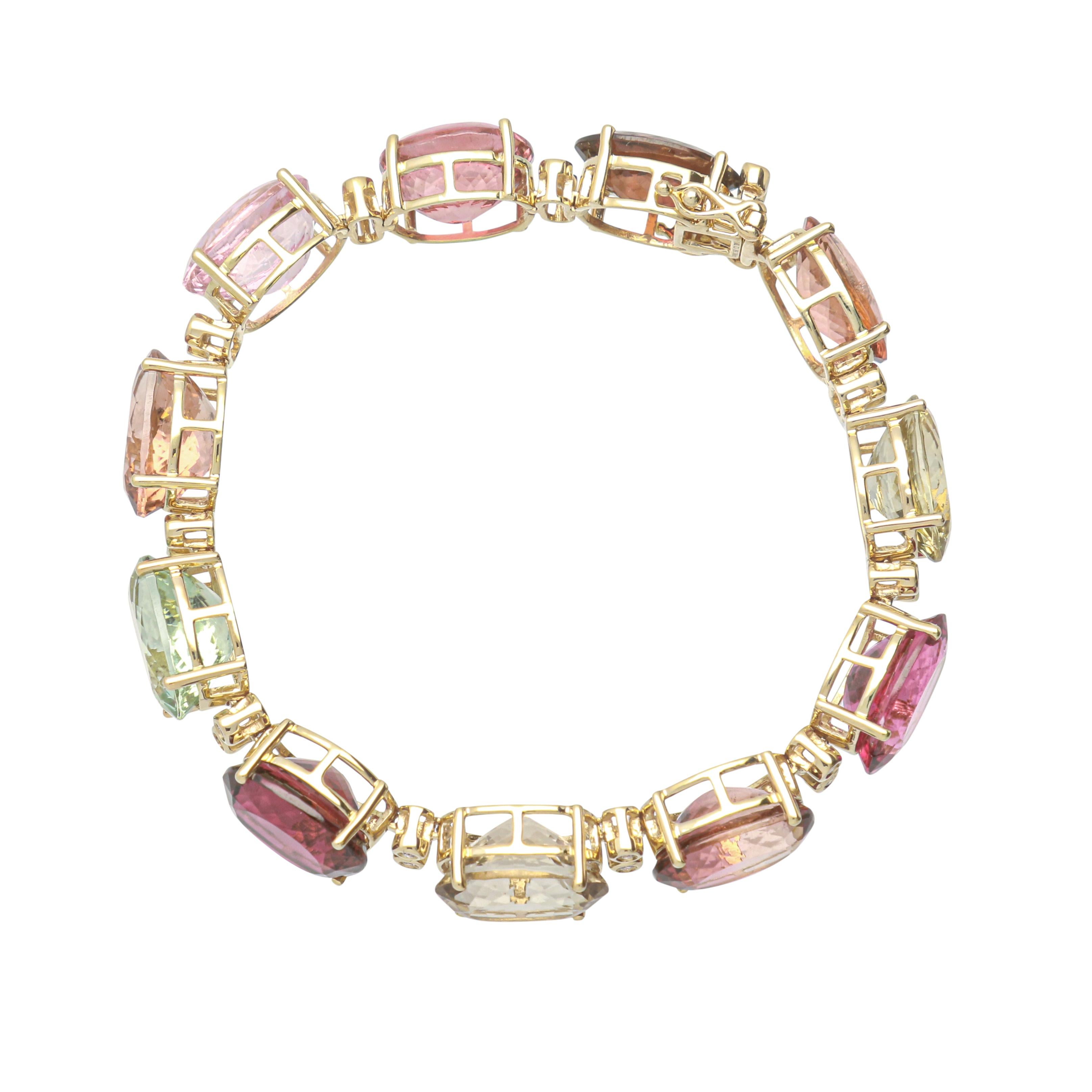 This one of a kind Bracelet is crafted in 14-karat Yellow Gold and features 11 Multi Color Tourmalines 66.98 Carat & 22 Round Diamonds with total carat weight of 0.22 Carat. This Bracelet comes in size 6.75