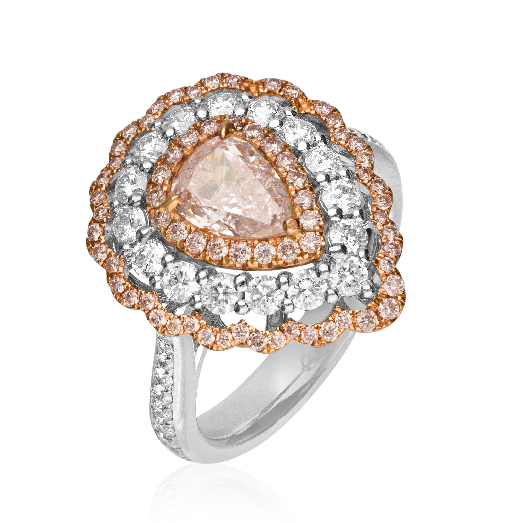 This beautiful Engagement ring is crafted in 18-karat Two Tone (Rose and White) gold. 
It features a GIA certified Pear shaped Natural Pink Diamond 1.01 Carat with I2 clarity, 69 Pink Diamonds 0.39 Carat and 34 Round white Diamonds 0.89 Carat.