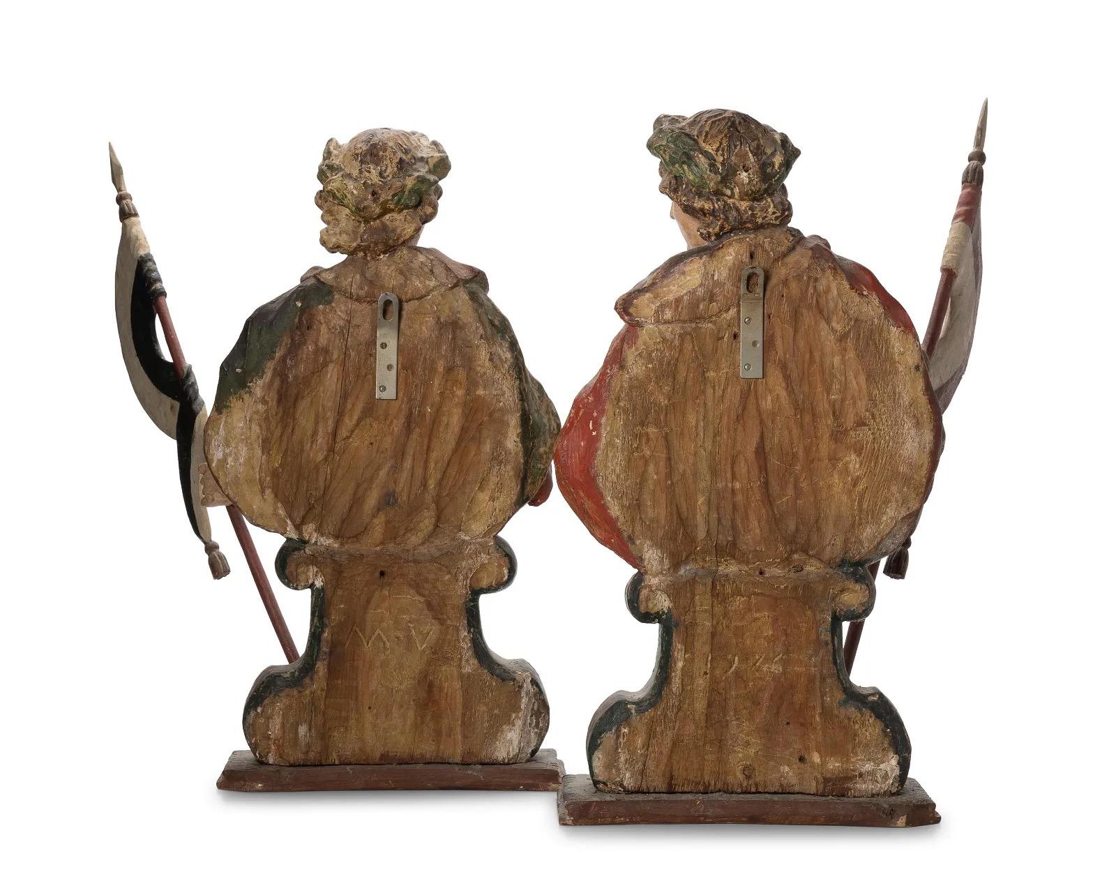 Behold a captivating pair of 18th-century hand-carved wooden treasures, dating from the remarkable span of 1717 to 1780. These exquisite pieces stand as a testament to the artistic mastery of their era, adorned with original polychrome and