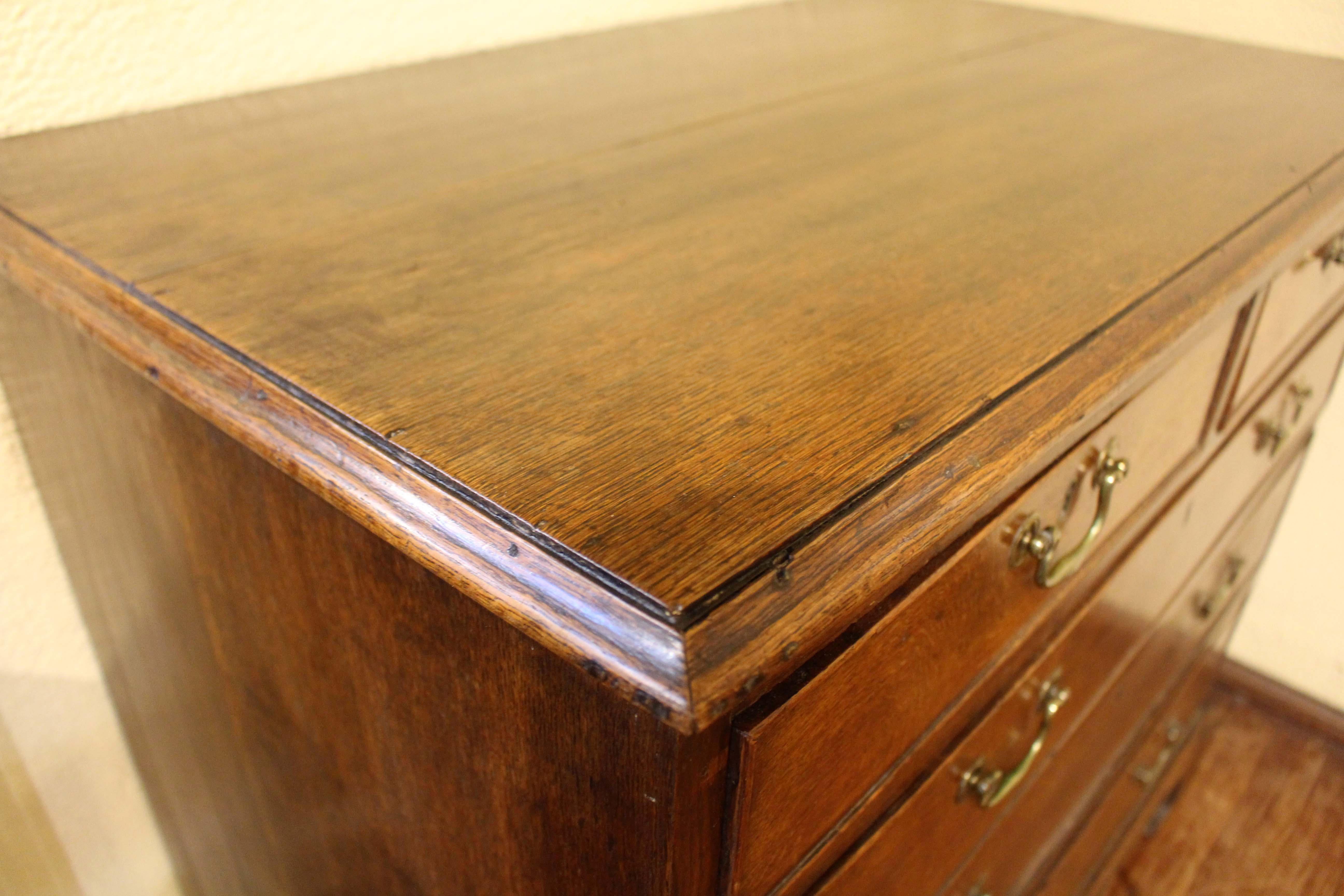 George III chest of drawers, oak, 2 over 3 drawer form. English, c.1760. Thumb molded top. Raised on well shaped bracket feet. Original bail & rosette pulls. A fine example of Georgian country house furniture.

We are a family business that has