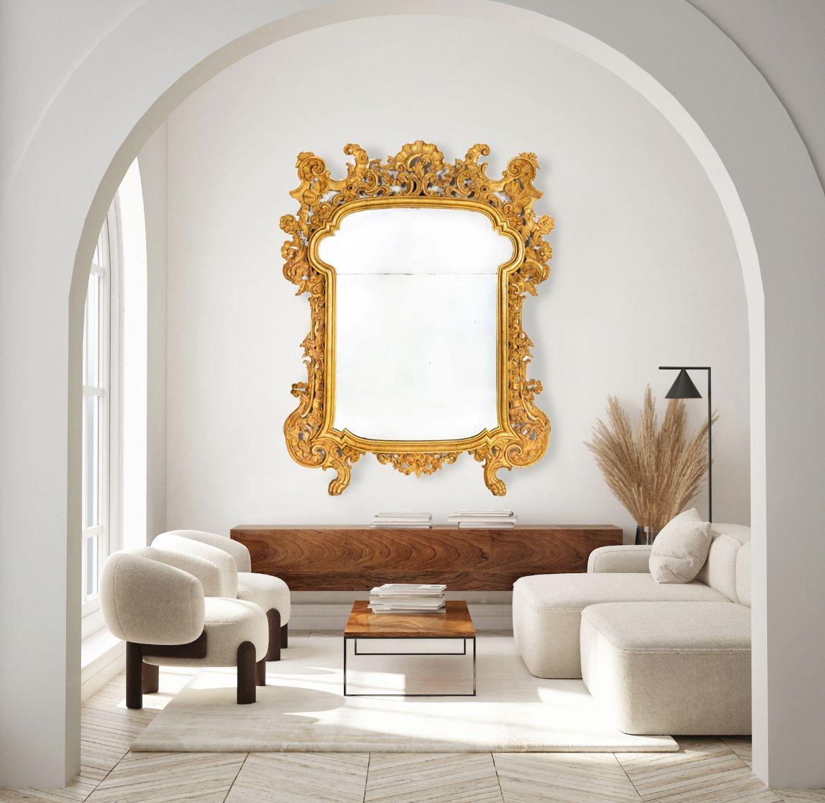 GRAN ESPEJO ITALIANO ROCOCÓ DE MADERA DORADA TALLADA
Probablemente Milán, hacia 1760
Artículo nº 403DWK11C

Espejo de pared rococó italiano de mediados del siglo XVIII, muy bueno y de gran envergadura, la pieza procede probablemente de Milán y sigue