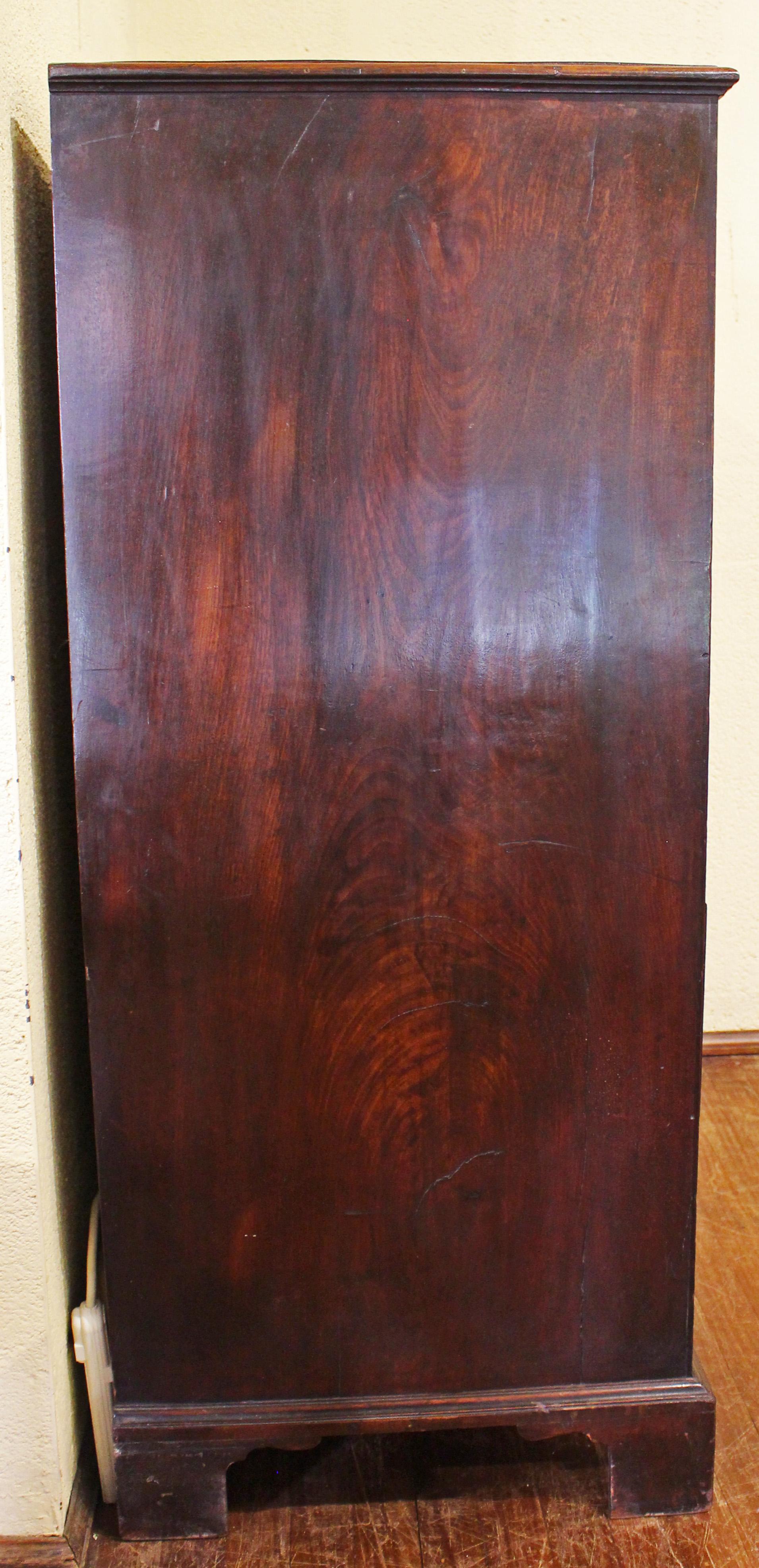Circa 1765-80 George III tall straight front chest of drawers, English. 2 short over 5 long, graduated drawers. Mahogany & mahogany veneers; deal secondary. Raised on original bracket feet with some old repairs. Original bail & rosette pulls. A