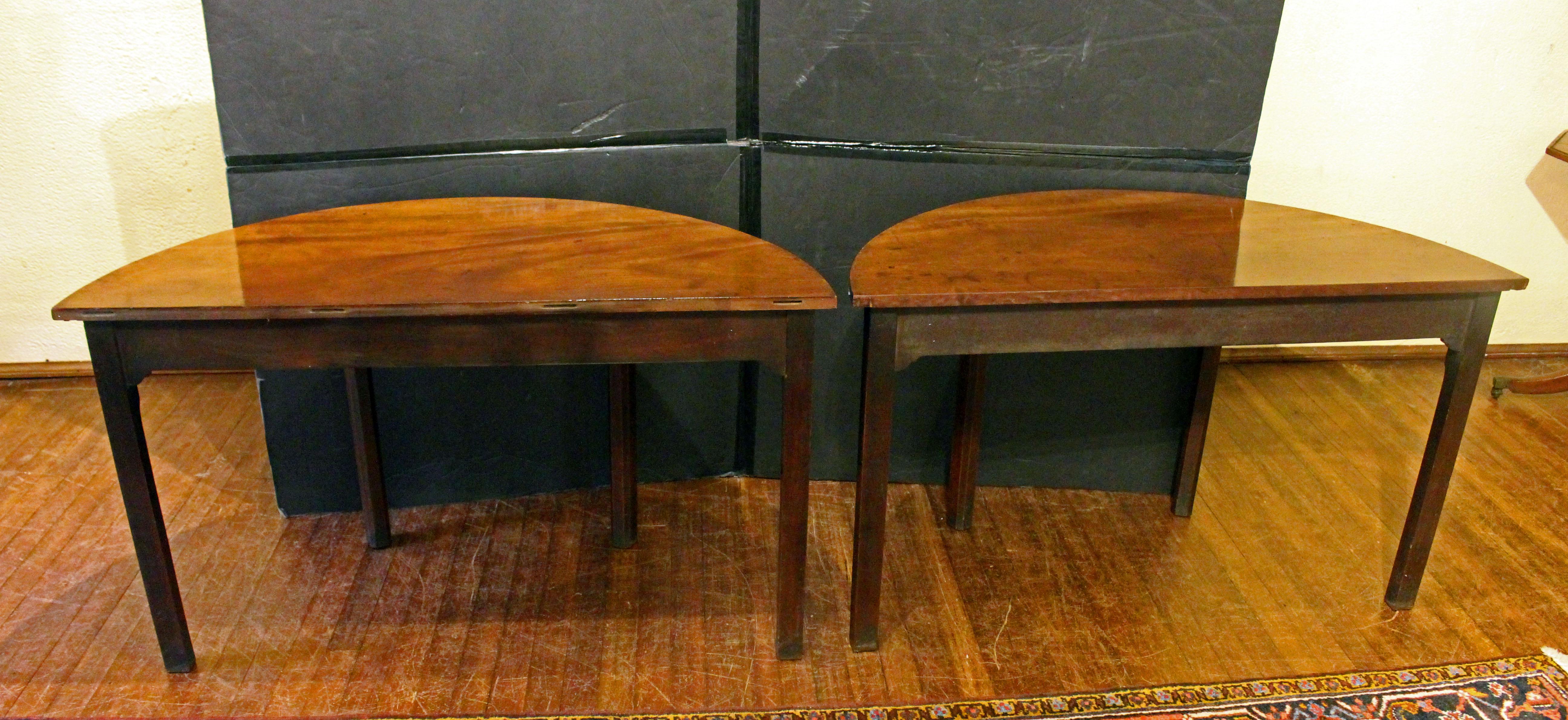 Circa 1765 George III period pair of console tables, English. Deep rich wood with deal secondary wood. These handsome tables, once part of a banquet table, show the solid design associated with provincial cabinetmakers of the finest quality.