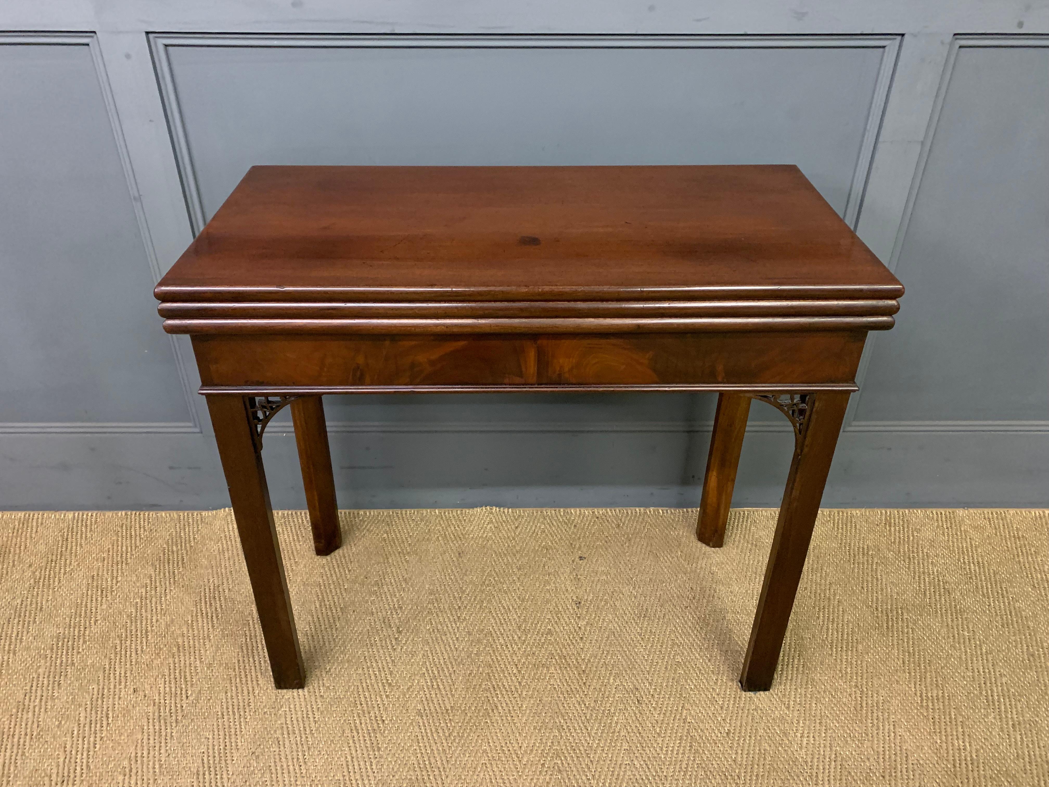 Circa 1765 Georgian period triple-fold games & tea table, English. The triple fold is a rare form. Raised on square legs with fine Gothic open fretwork returns. Finish & baized surfaces for tea & games respectively. Concealed side apron drawer.
33