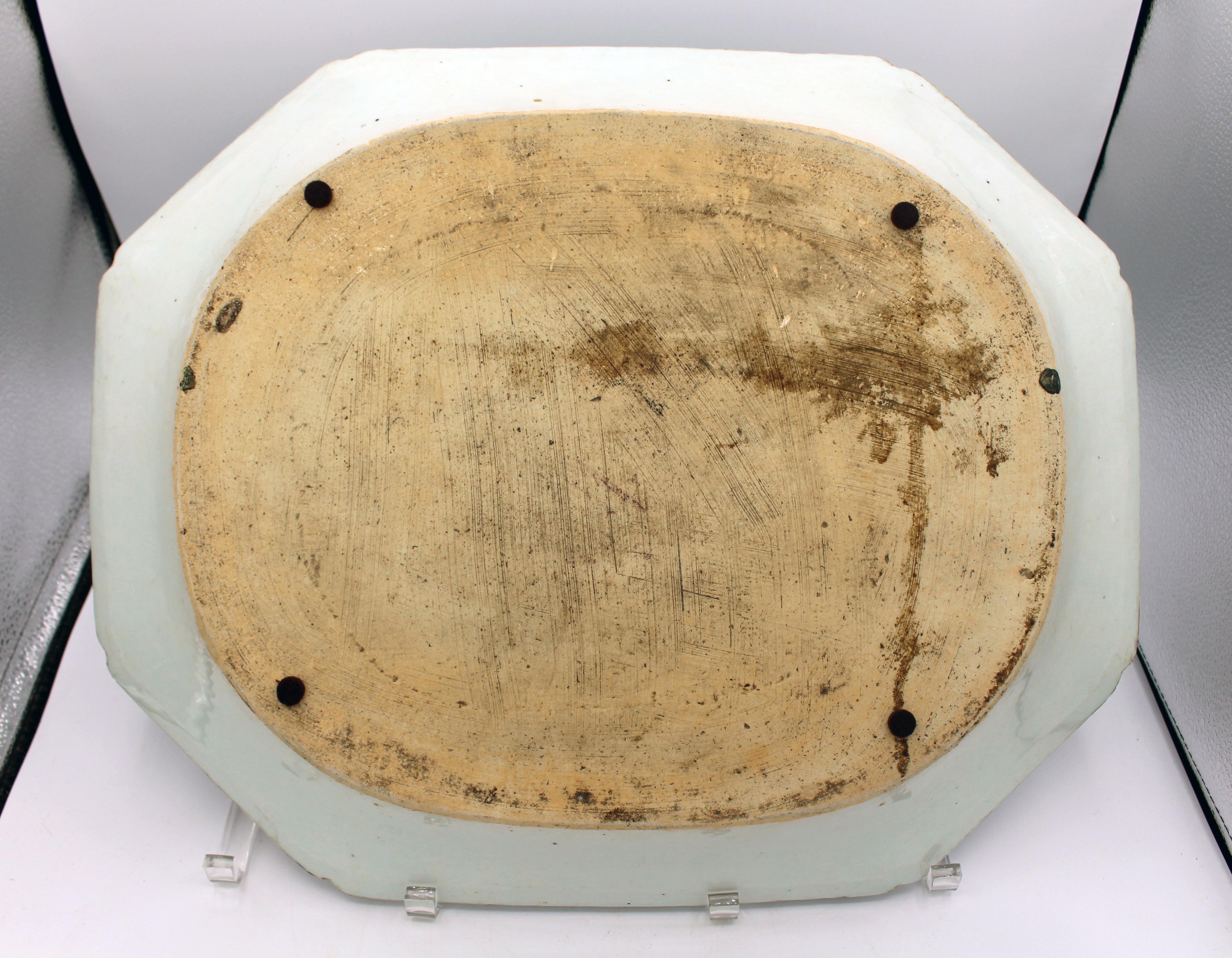 Circa 1780 Chinese Export blue & white large platter. Bold & deep octagonal form with incut corners. Decorated with a rich garden with auspicious flowers & fungus. Qianlong period. Rim frits. 18