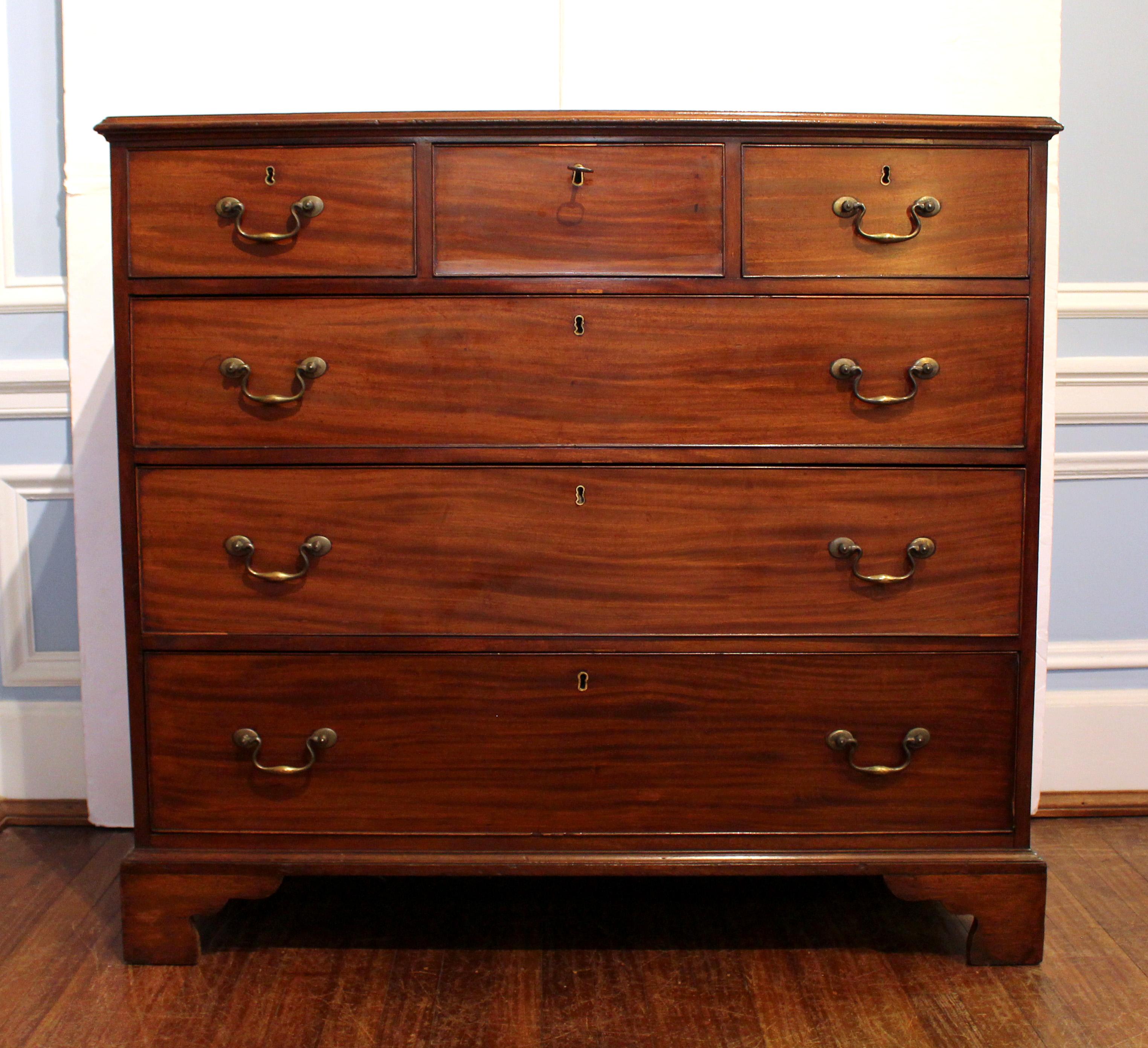 Circa 1780 Scottish 3 over 3 drawer chest of drawers. Well molded top. Mahogany with oak secondary wood. Original bail & rosette handles. The central upper drawer with just a key for opening maintaining the overall aesthetic of the piece. Well