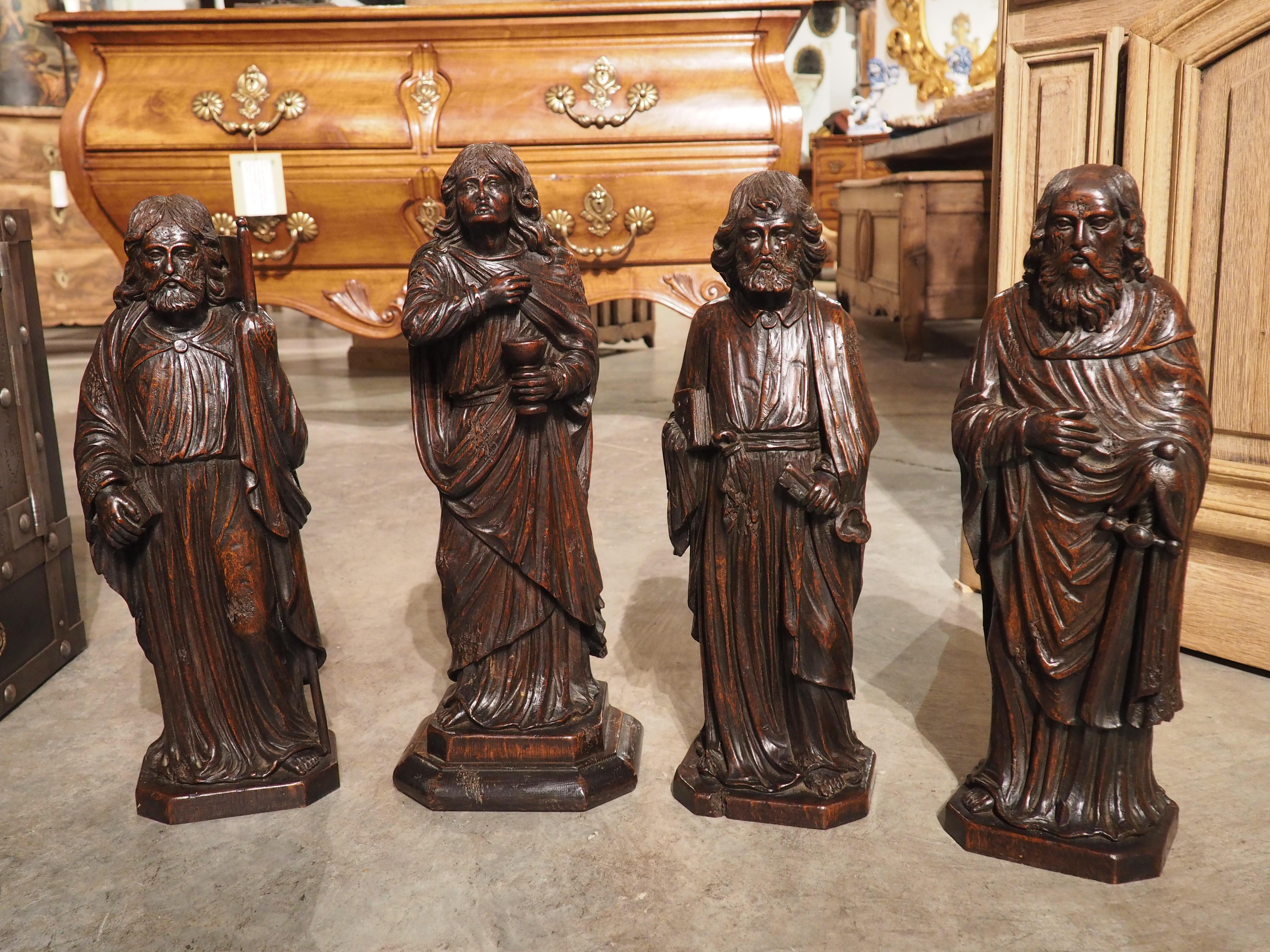 Hand-carved in oak, circa 1800, these sculptures depict arguably the most important apostles: James, John, Peter, and Paul. All of the figures are distinctly different, although they share some commonalities, such as they are all barefoot and clad