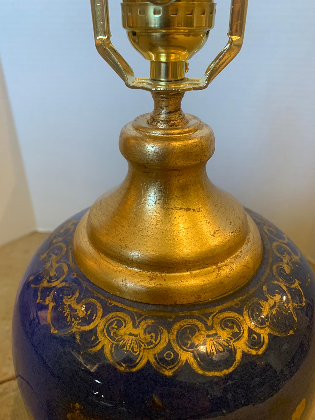 Chinese blue and gilt porcelain lamp on custom giltwood base, circa 1800
New wiring.