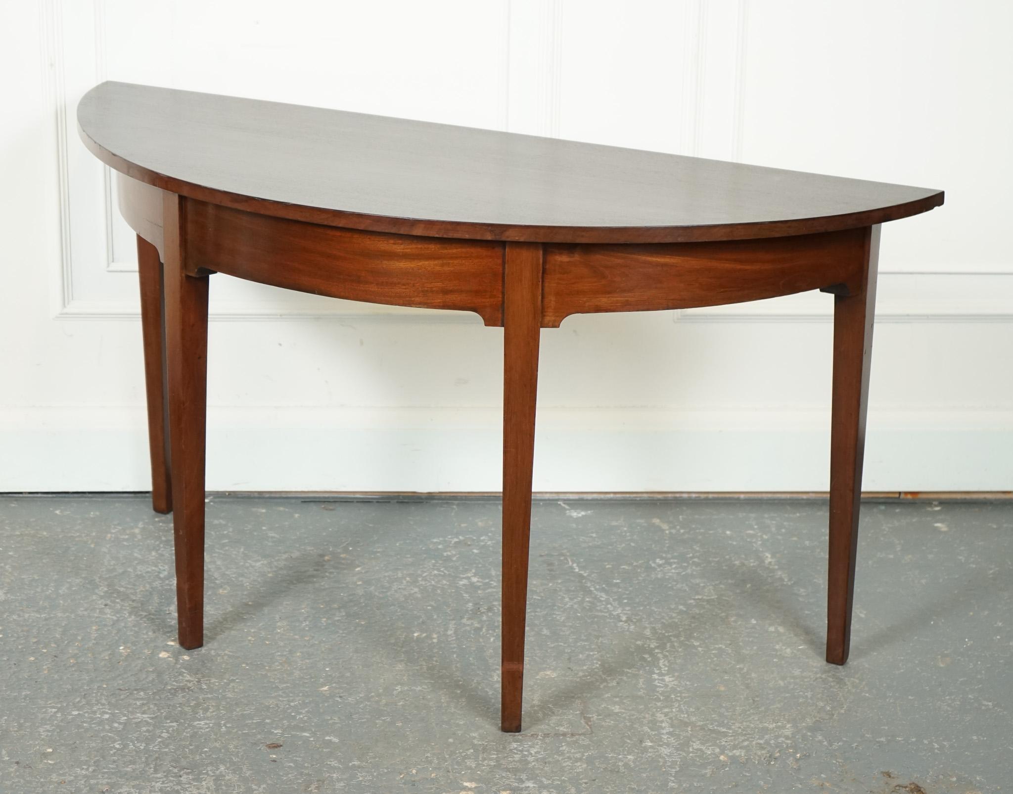 
We are delighted to offer for sale this Lovely George III Demi Lune Table.

This circa 1800 George III demi-lune hall side end table exudes an air of timeless elegance and sophistication. Crafted during the peak of the Georgian era, this piece