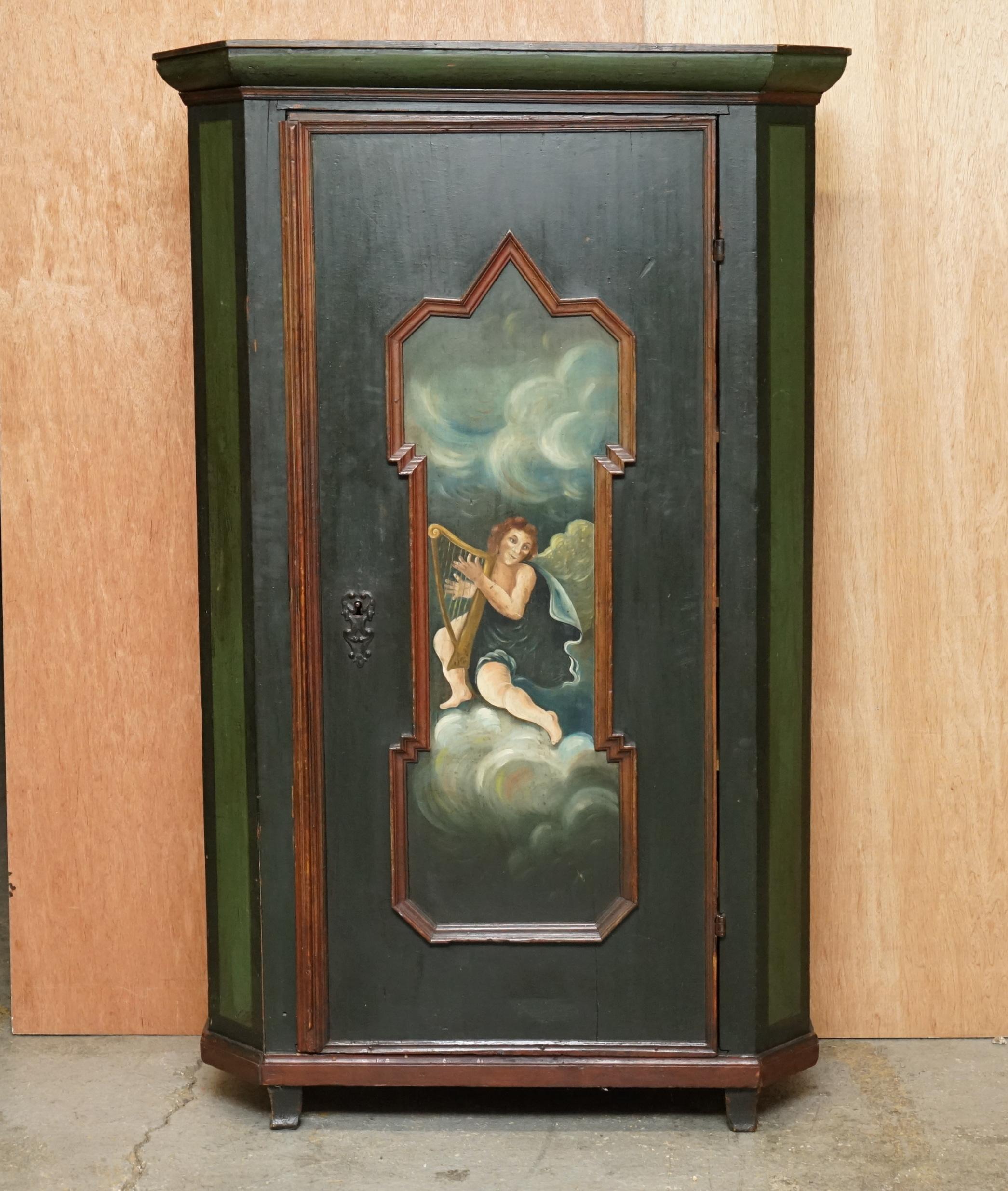 We are delighted to offer for sale this stunning original Swedish circa 1800 hand painted green with angel playing a harp decoration hall cupboard or wardrobe

A very good looking well made and collectable cupboard. Made for the hall as a cloak