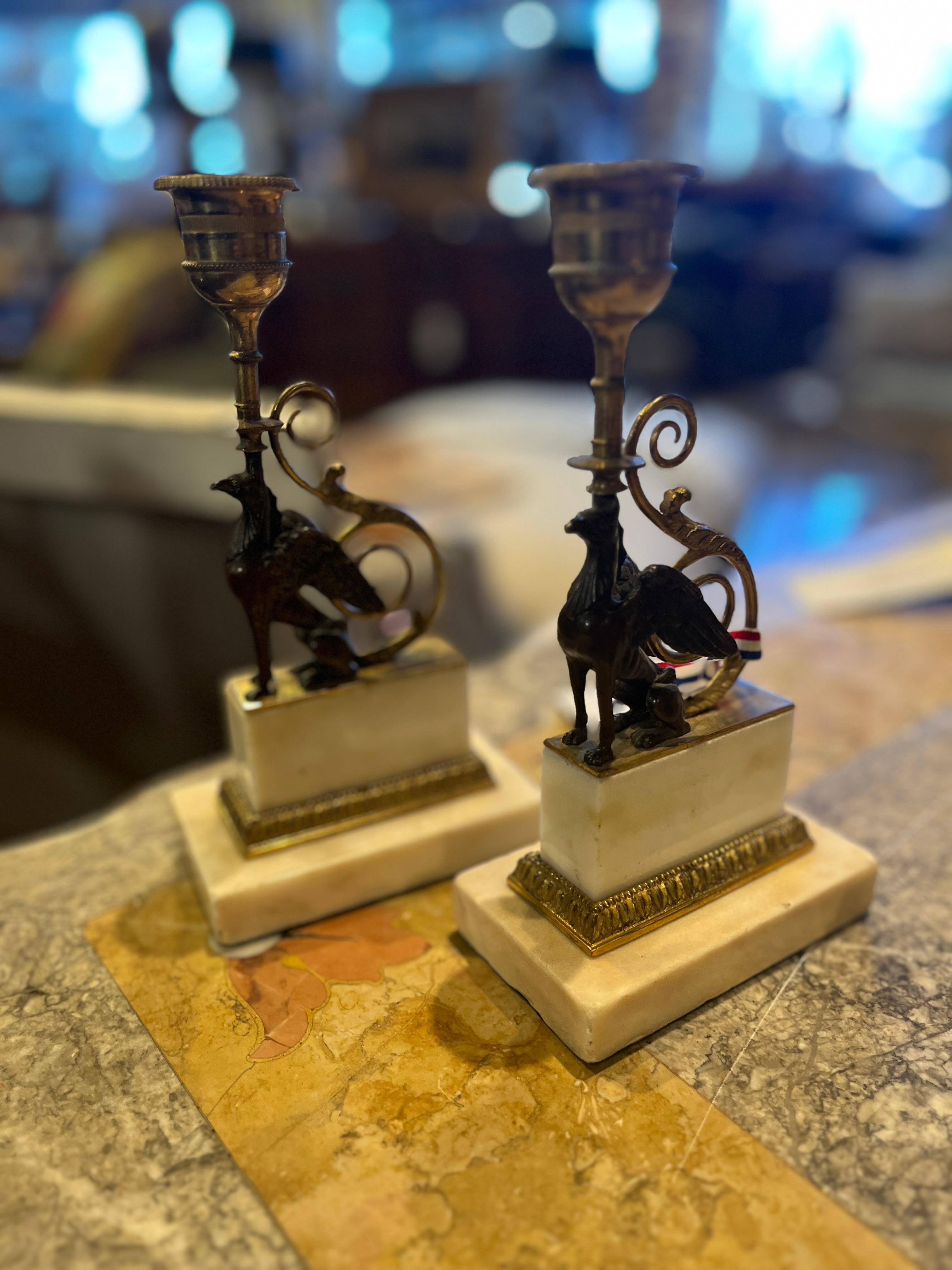 Circa 1800 Pair of French Gilt Bronze Griffin Candle Holders. Unique pair purchased in France. Age appropriate wear, see detailed photos or message us with questions. 
