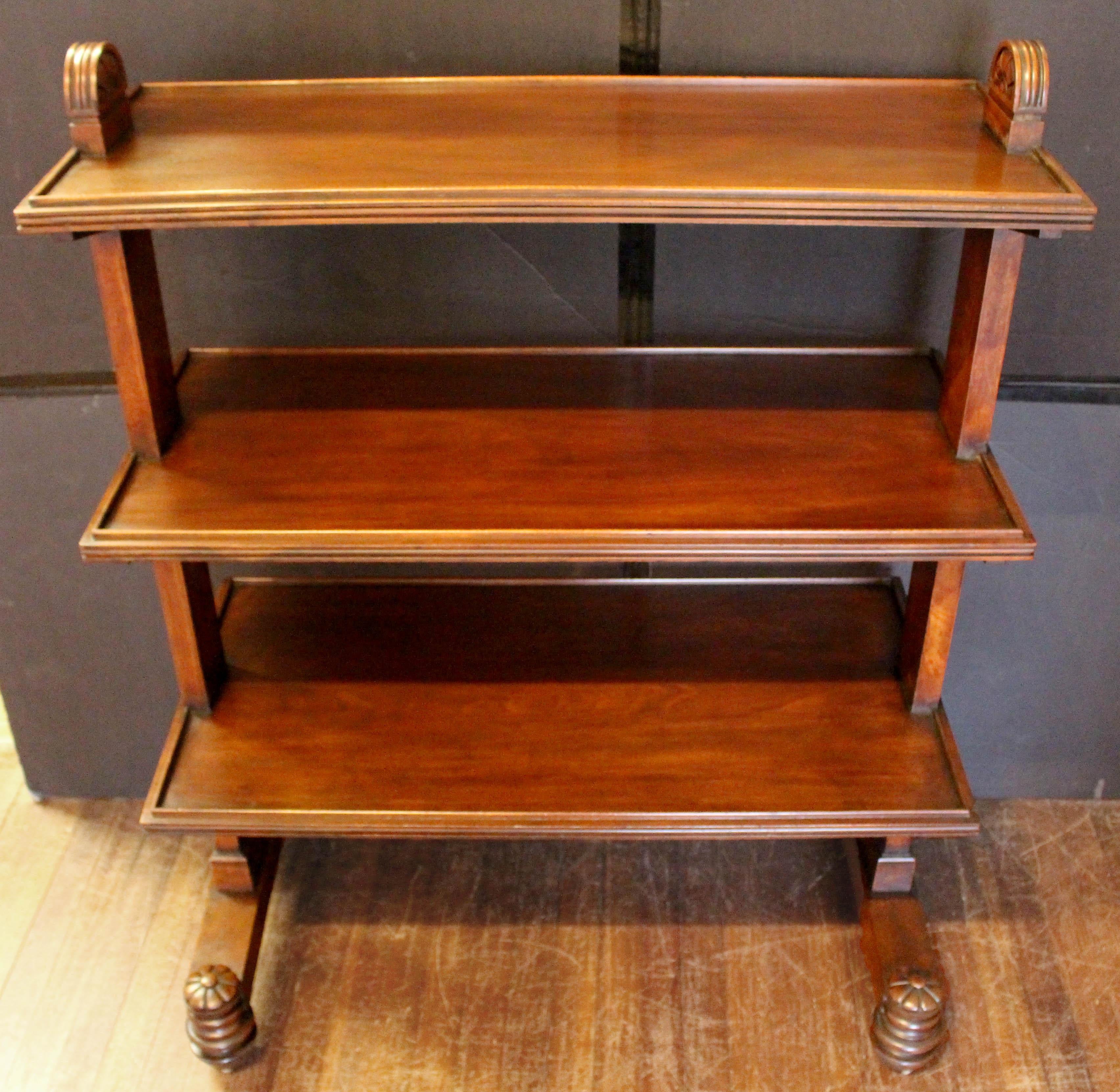 Circa 1820-30 George IV butler's trolley etagere, English. Mahogany. 3-tiers of graduated depths with molded gadrooned demi-rosettes atop the vertical upright sides. The tiers with full gallery edges and reeded moldings and each with elongated