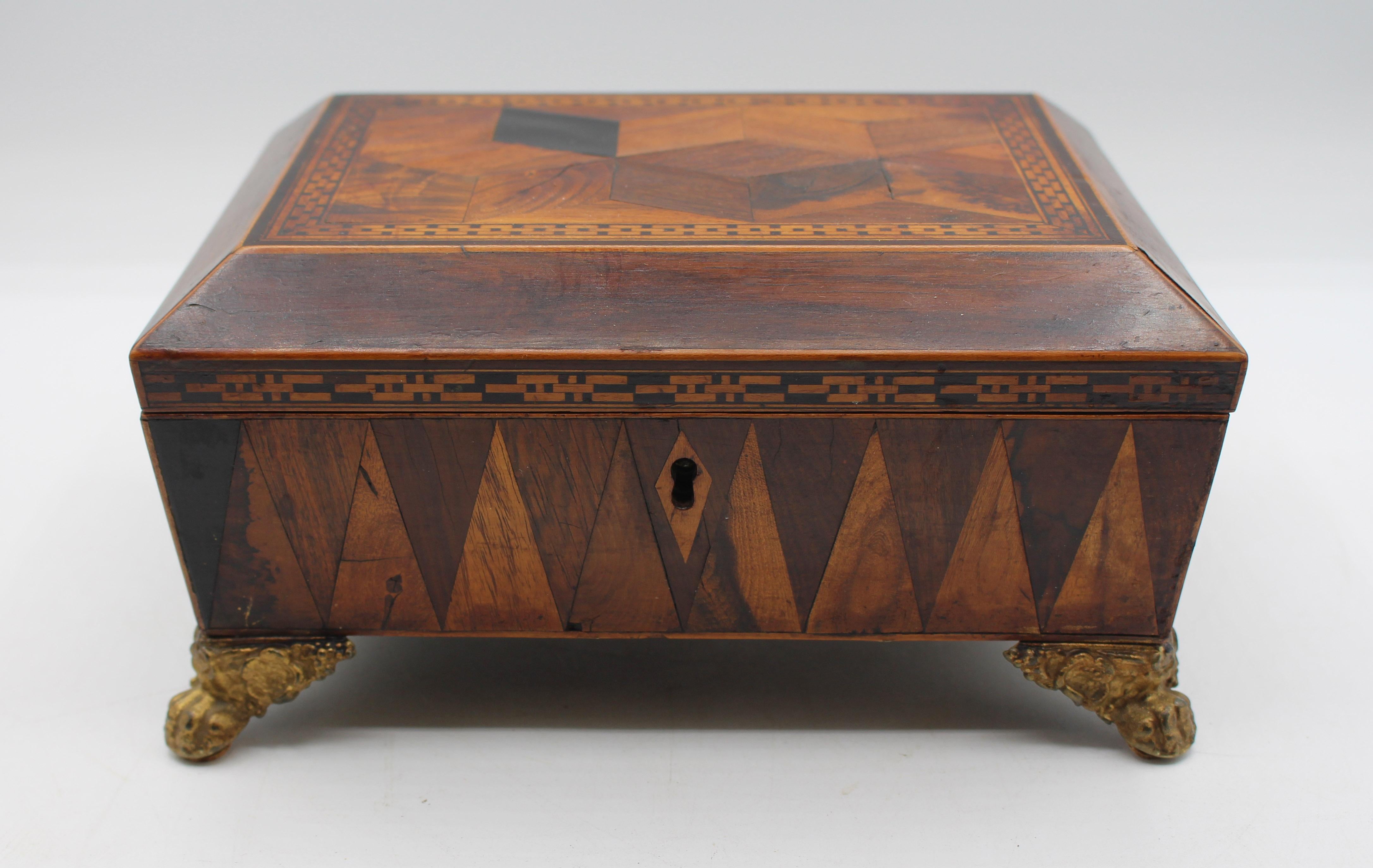 Circa 1820 Regency period work box, English. Infinitely charming with tumbling block inlaid top with triple chain motif inlaid border (repeated along the front edges as well) & boxwood stringing outlining the elevated central top section following