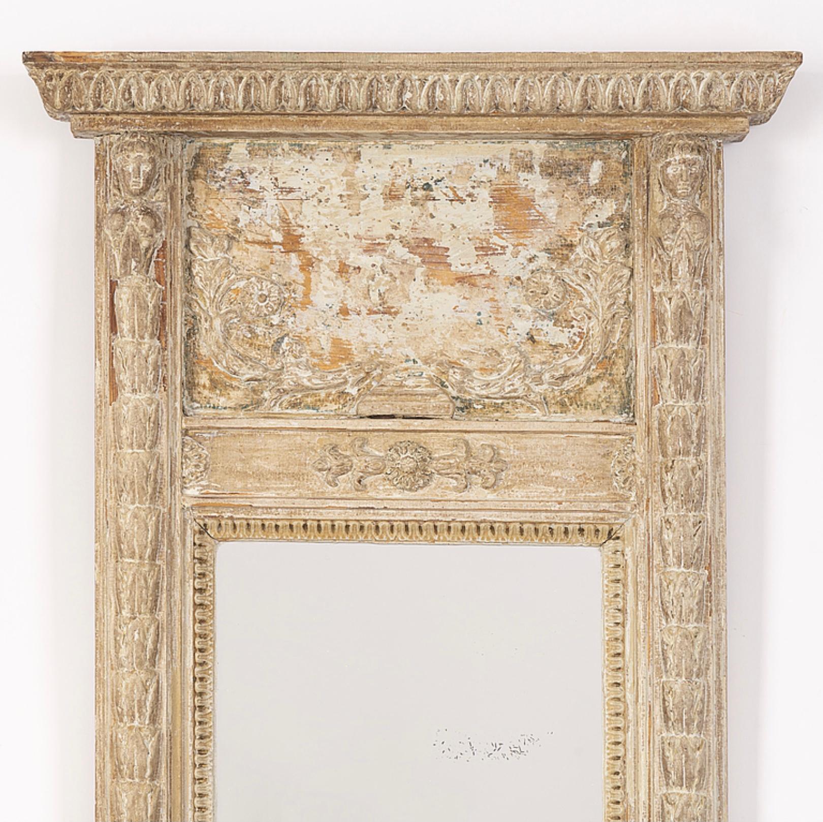 Wonderfully pale, this Swedish Empire style mirror circa 1820 has been stripped of its gilt, down to its pale soft tones beneath.
The mirrored glass has been replaced and some of its classic detail is missing which does not detract from its beauty.