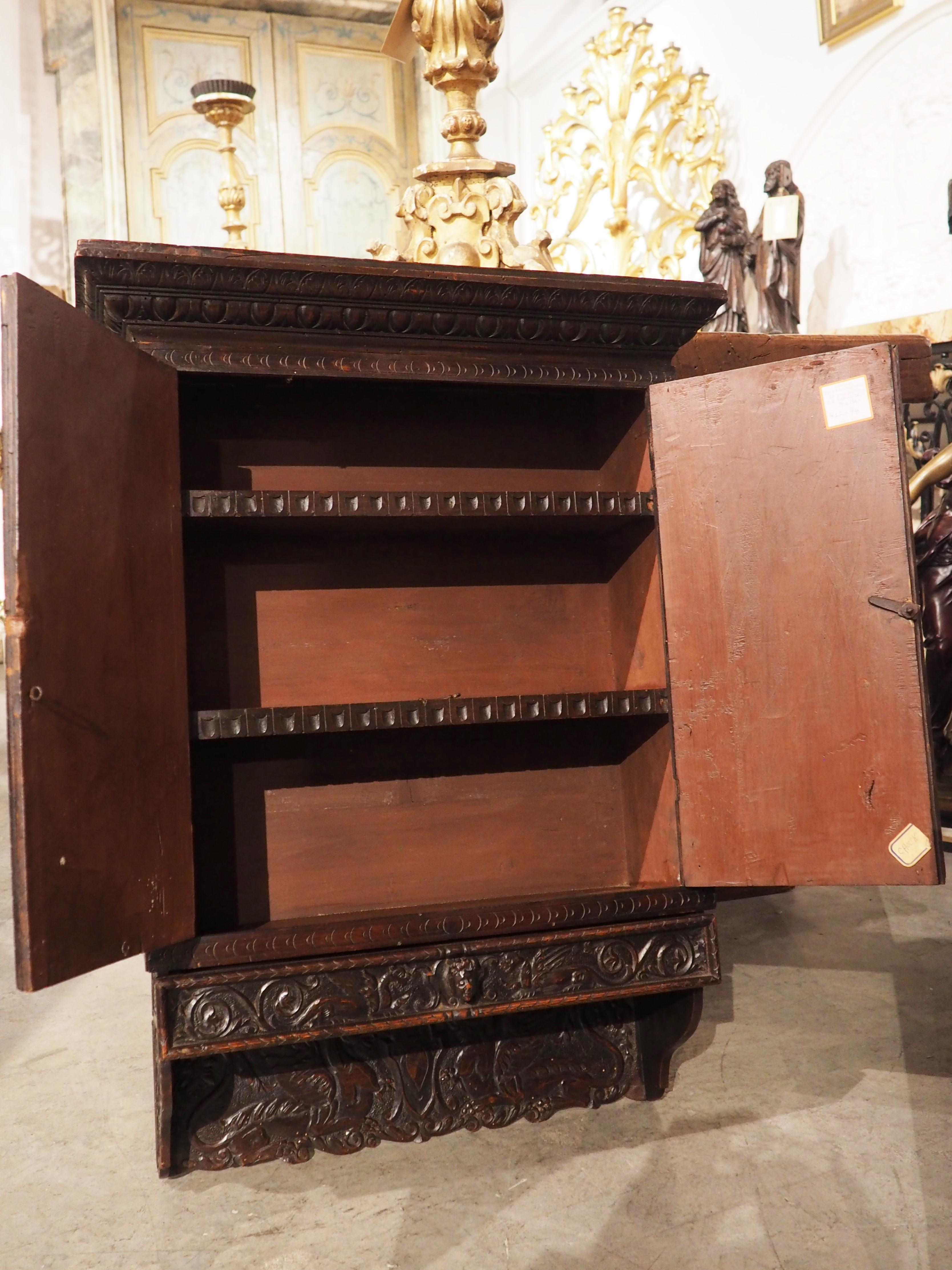 Mid-19th Century Circa 1830, Italian, Walnut Wood Wall Cabinet in the Renaissance Style For Sale