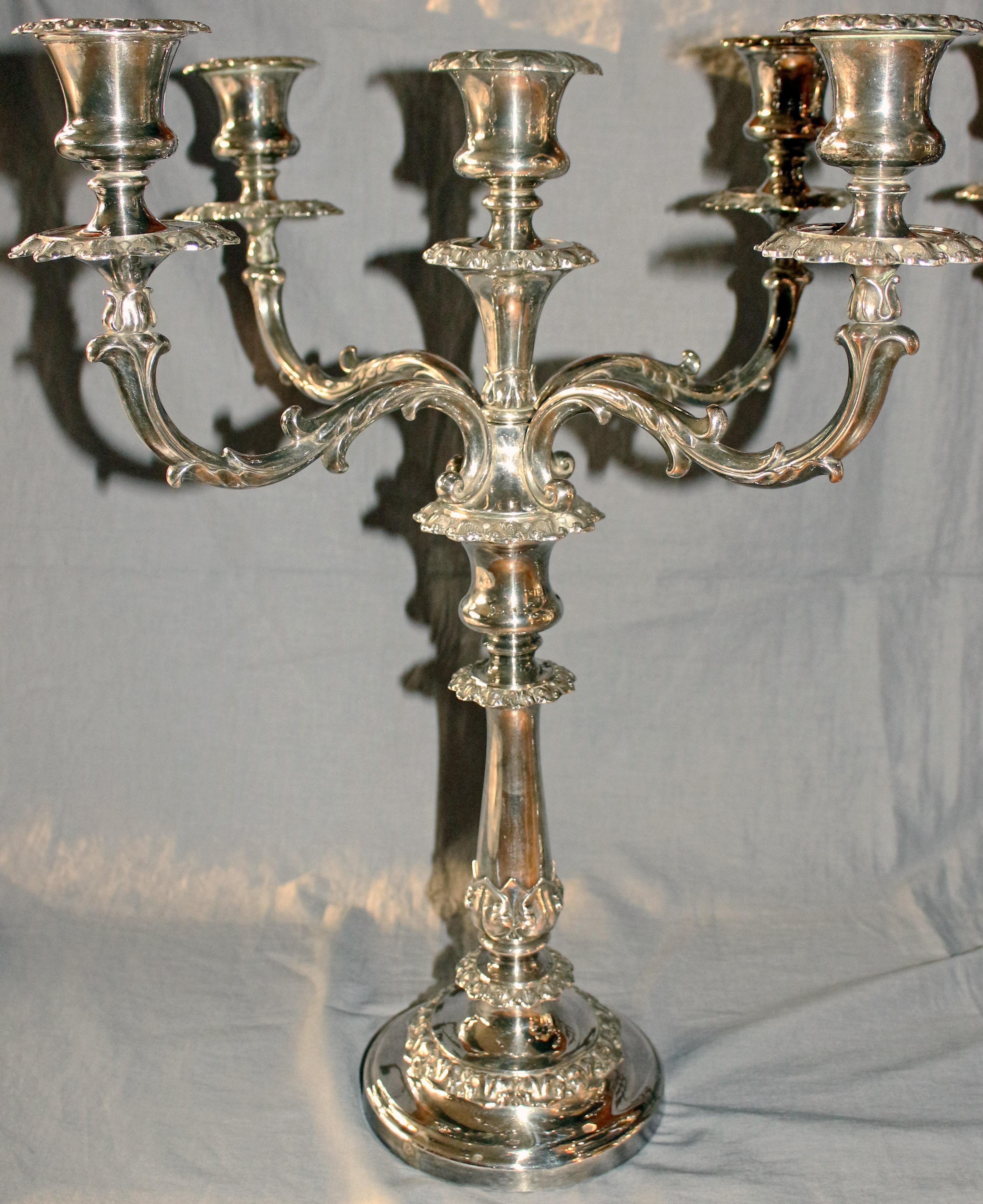 A handsome pair of 5-light candelabras. Old Sheffield Plate by Matthew Boulton, each fully marked 1 or 2. Most bobeche bases have a workman's mark. Late Georgian, c. 1830, displaying Classical leaf motifs. They can also be used as 3-light or single