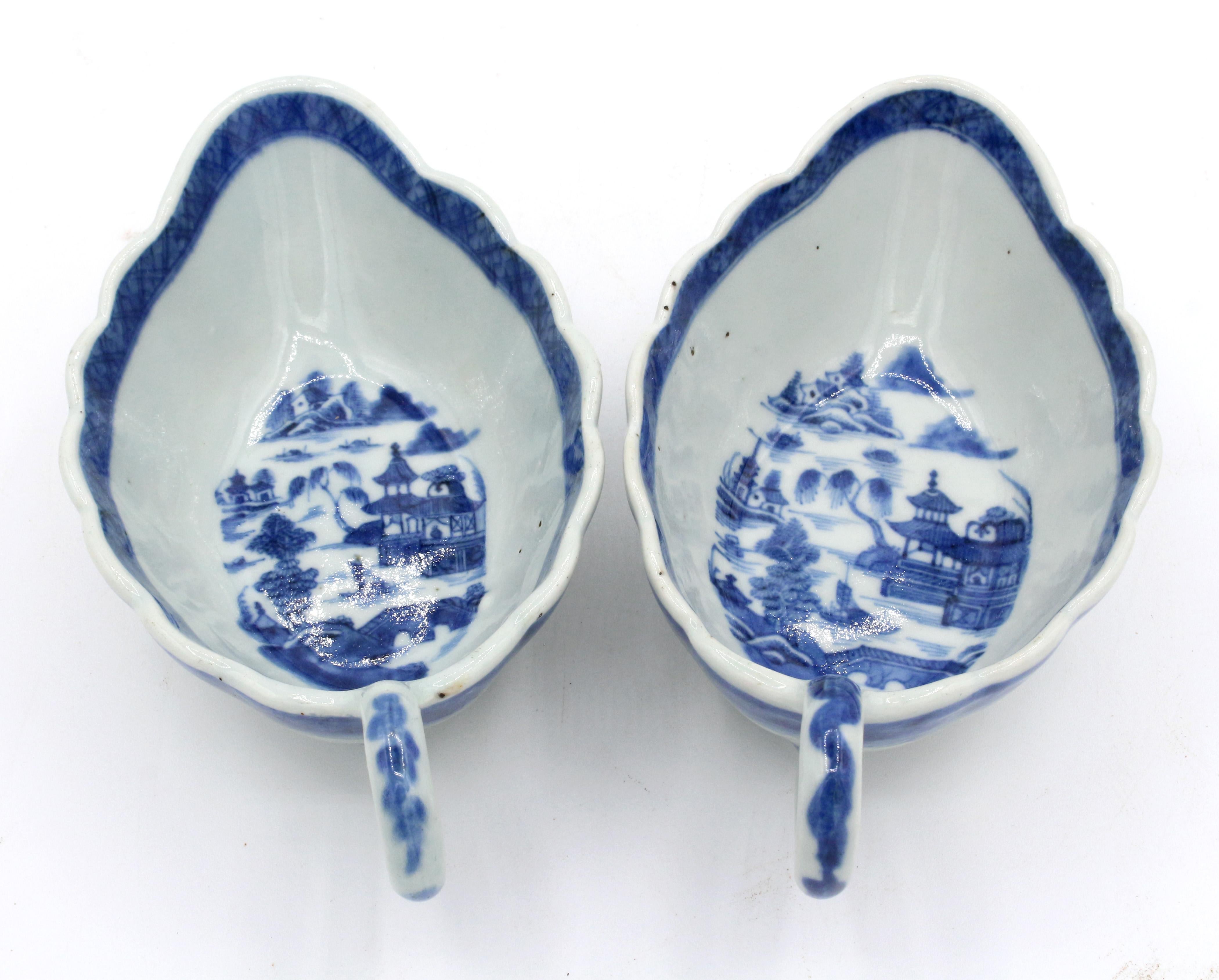 Circa 1830 near pair of Blue Canton sauce boats, Chinese. Leaf shaped with undulating borders & loop handles. Some kiln pops. Stilt marks. 7.5