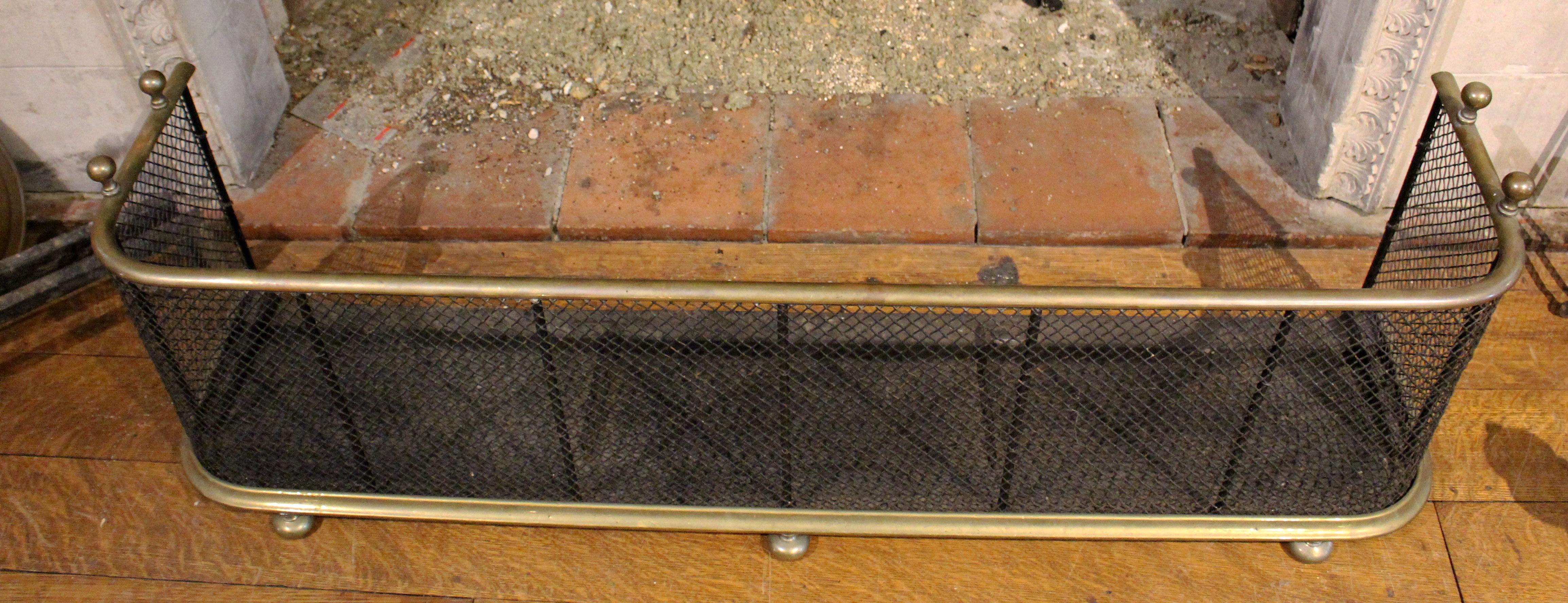 A very good circa 1840-1860 English low nursery fender with brass trim, brass tool rests, woven wire & hearth guard.
48