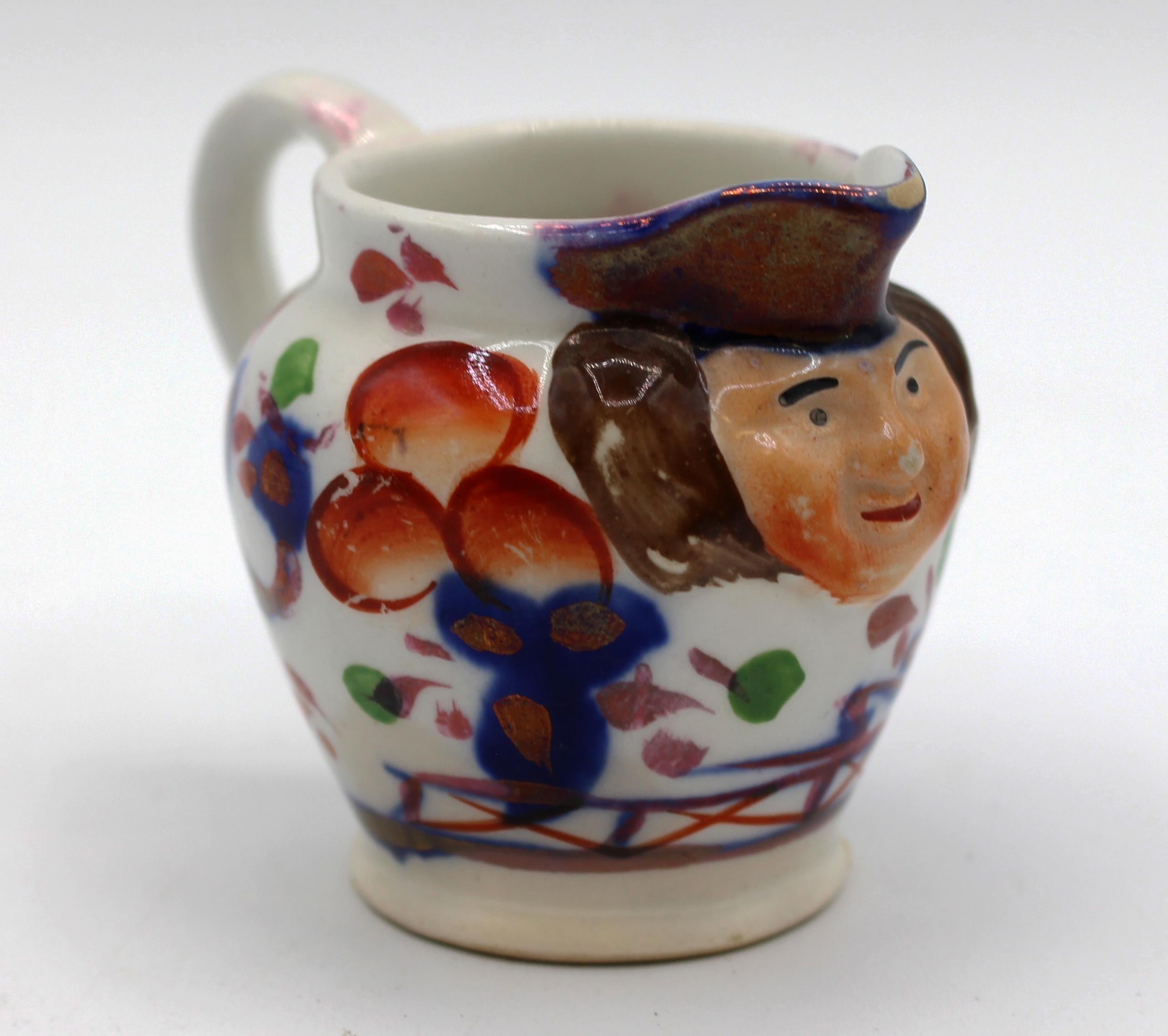 circa 1840-60 Gaudy Welsh face spout miniature jug. Impressed 