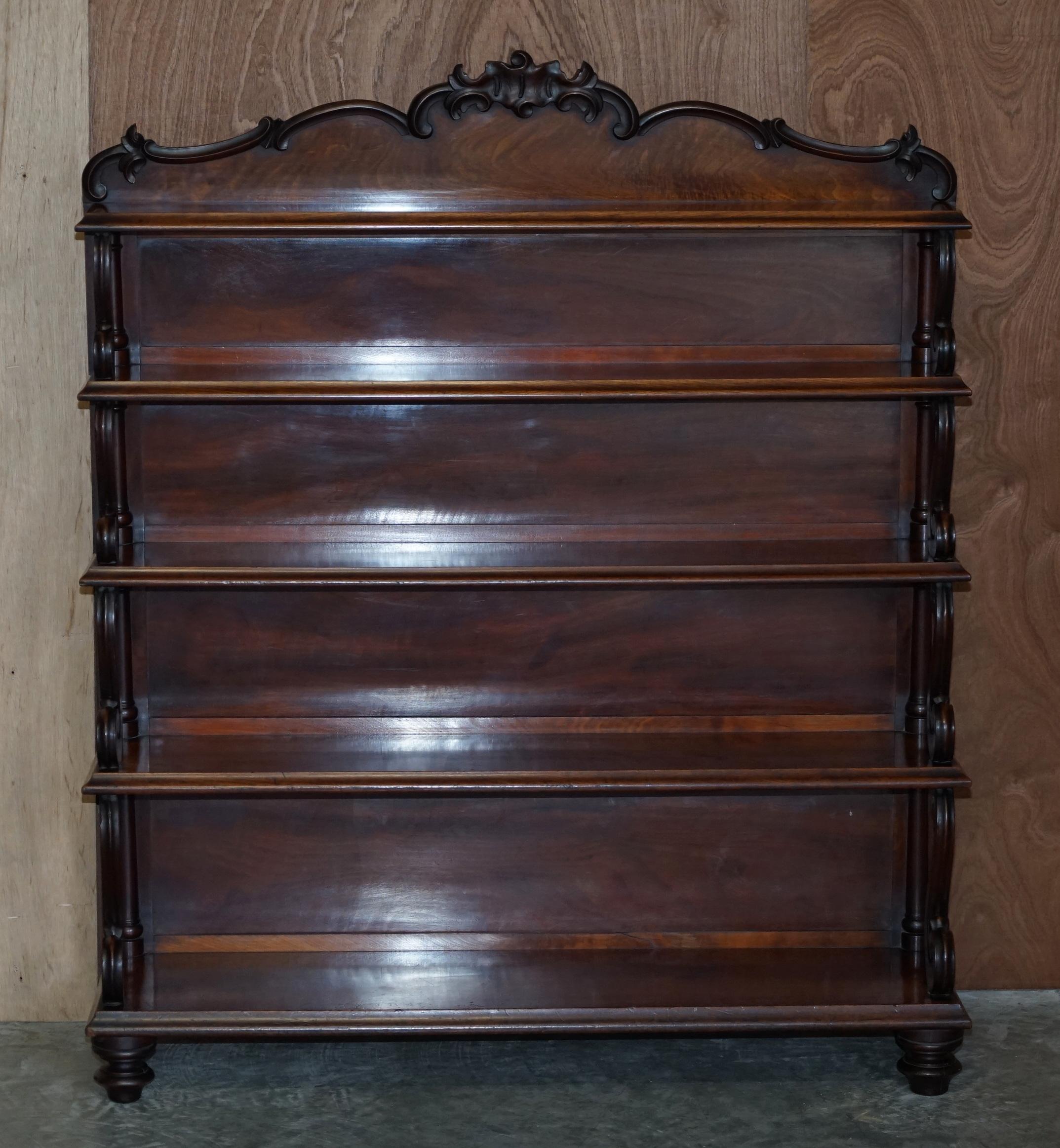 We are delighted to offer for sale this extremely solid hand carved early Victorian circa 1840 Waterfall open bookcase 

A very desirable piece of fine English library furniture. The timber is extremely heavy for the size, it weighs about twice as