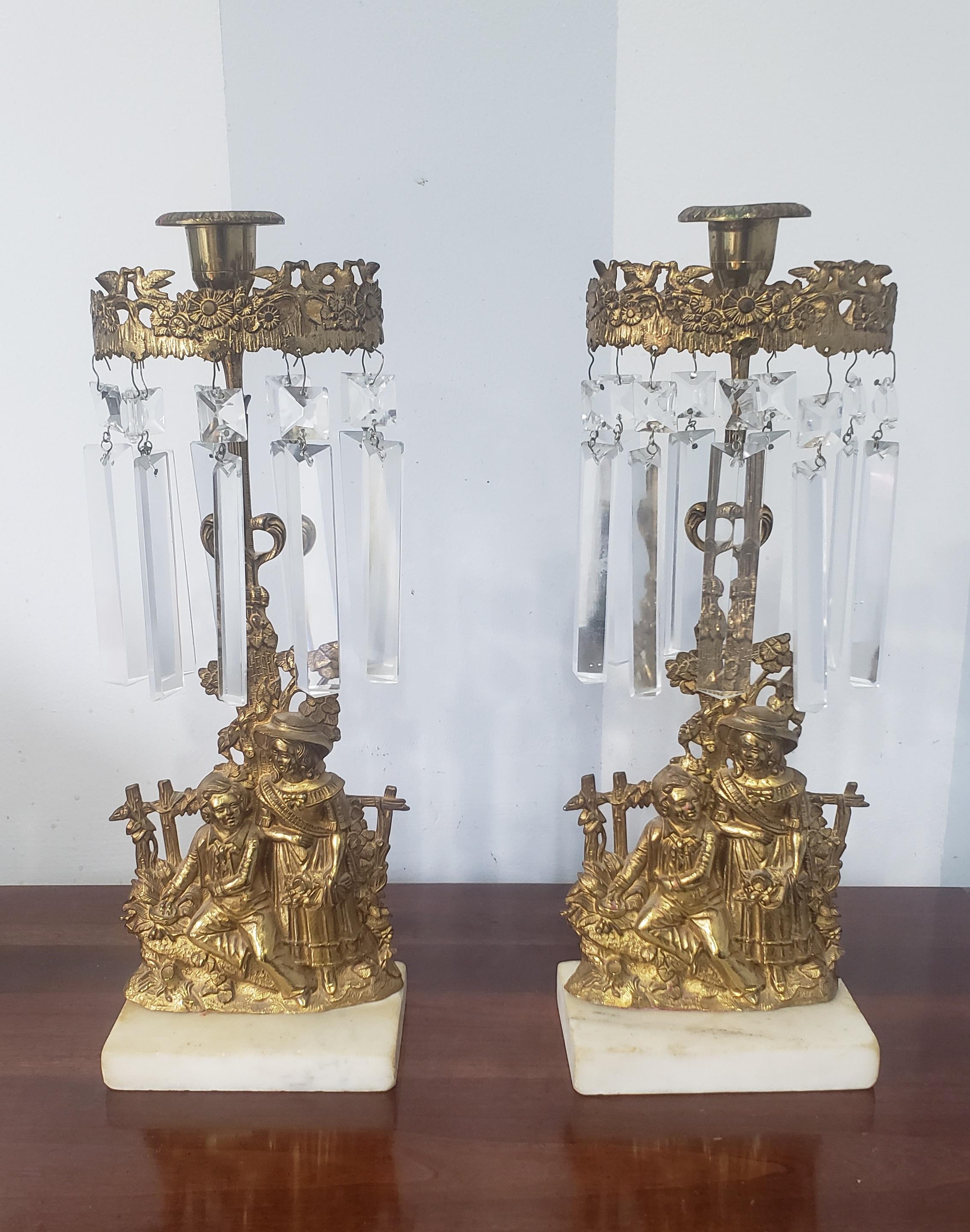 A pair of 1840s Cornelius and Co. Cast Brass & Marble Girandole Candlesticks with crystal pendulums.
Measures 13.25