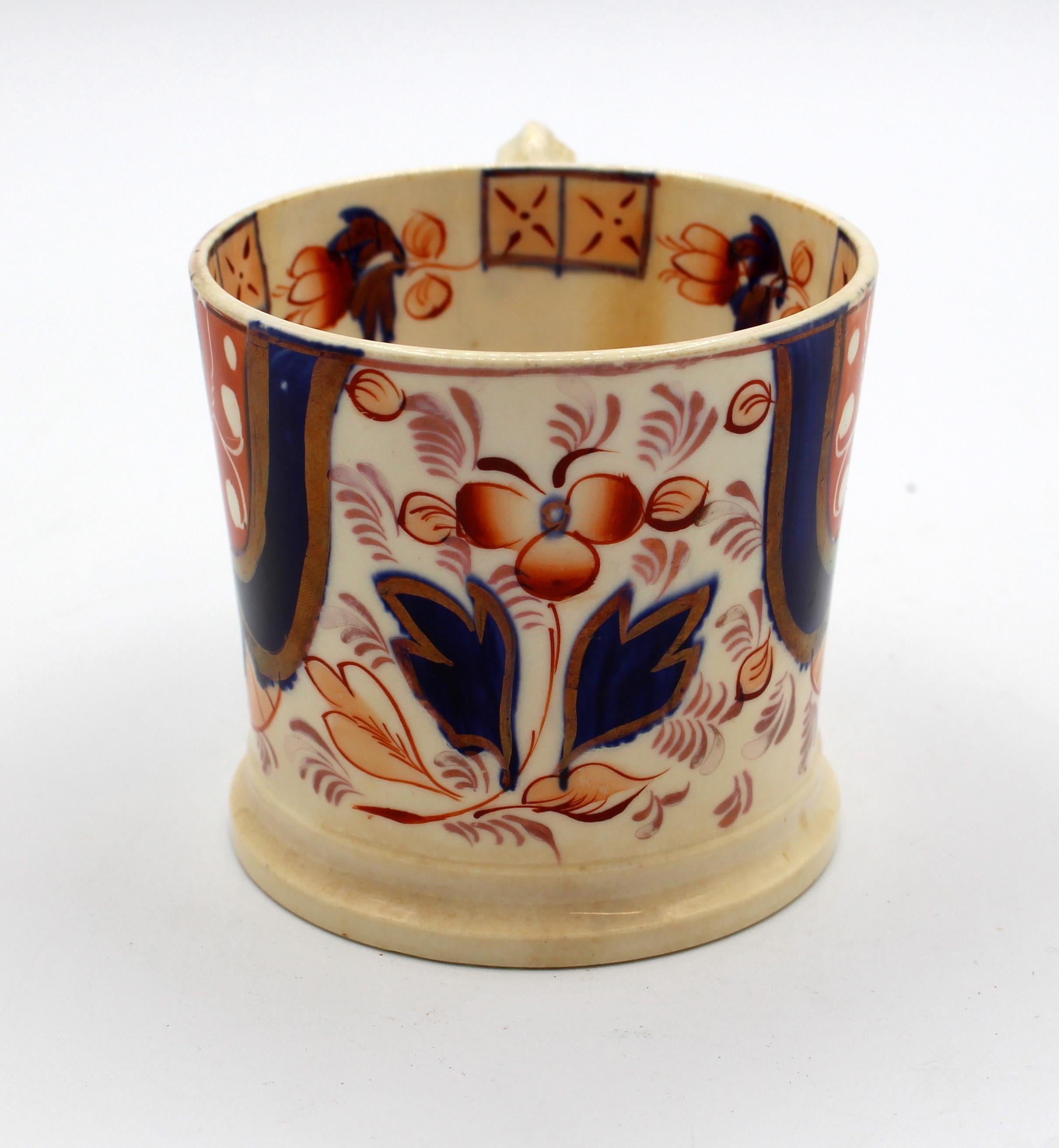circa 1840s Gaudy Welsh Asian or Hexagen porcelain tankard. Bold orange, underglaze blue & luster highlights. Hairlines in base & some staining. Measures: 4.5
