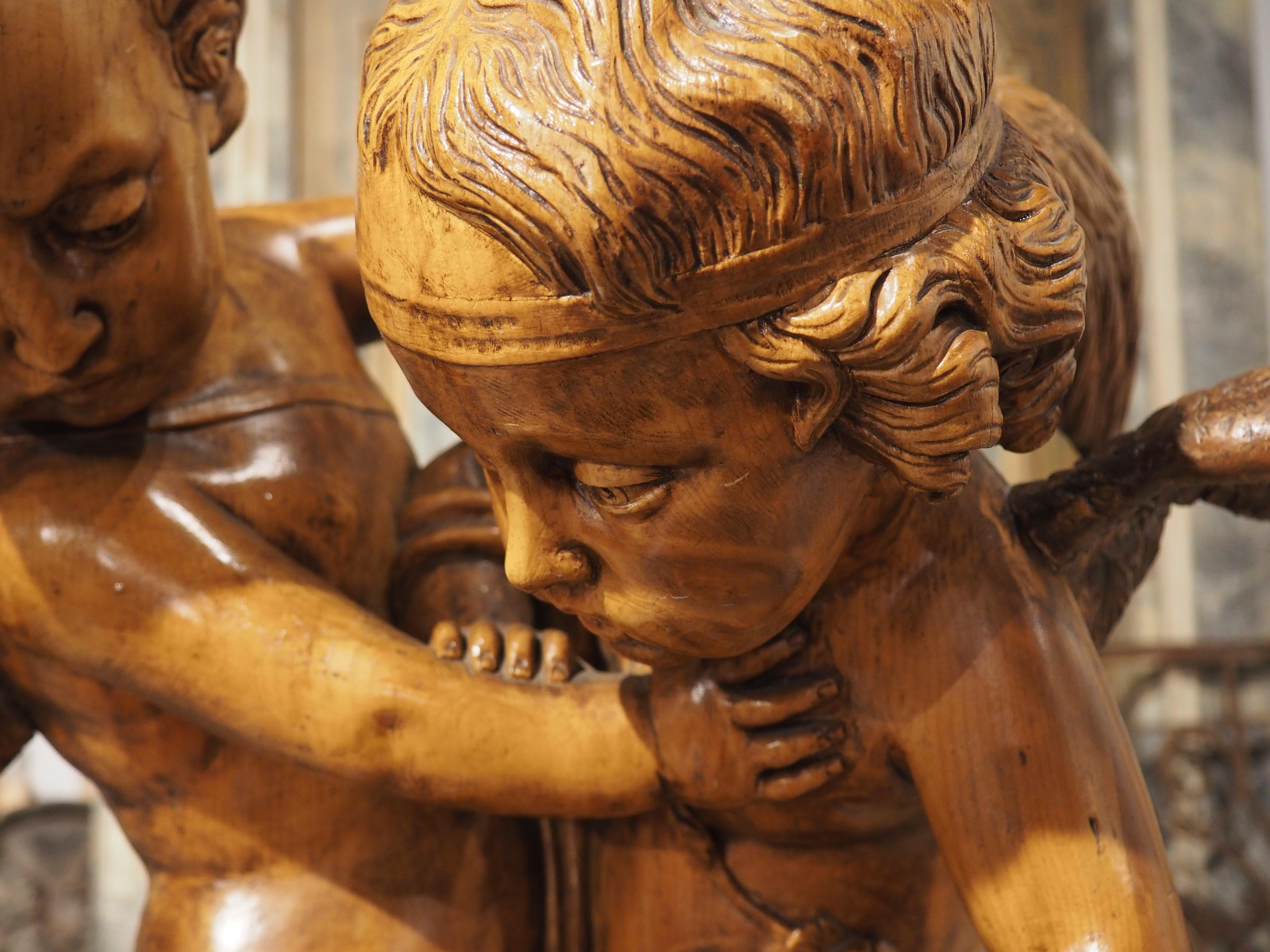 Français Sculpture française représentant deux cupidons se disputant un cœur, d'après E. Falconet, vers 1850 en vente