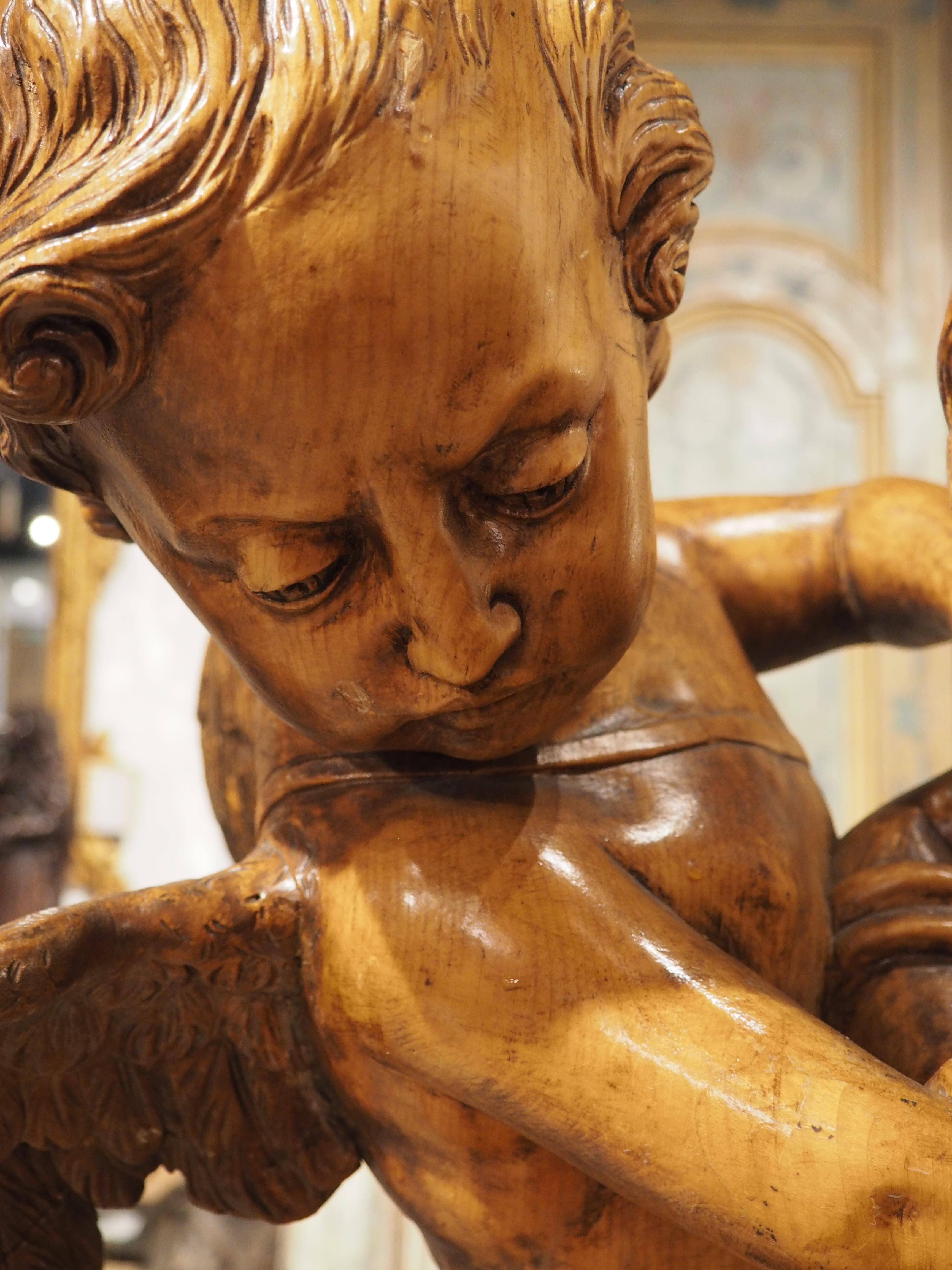 Hand-Carved French Sculpture of Two Cupids Contesting a Heart, After E. Falconet, circa 1850 For Sale