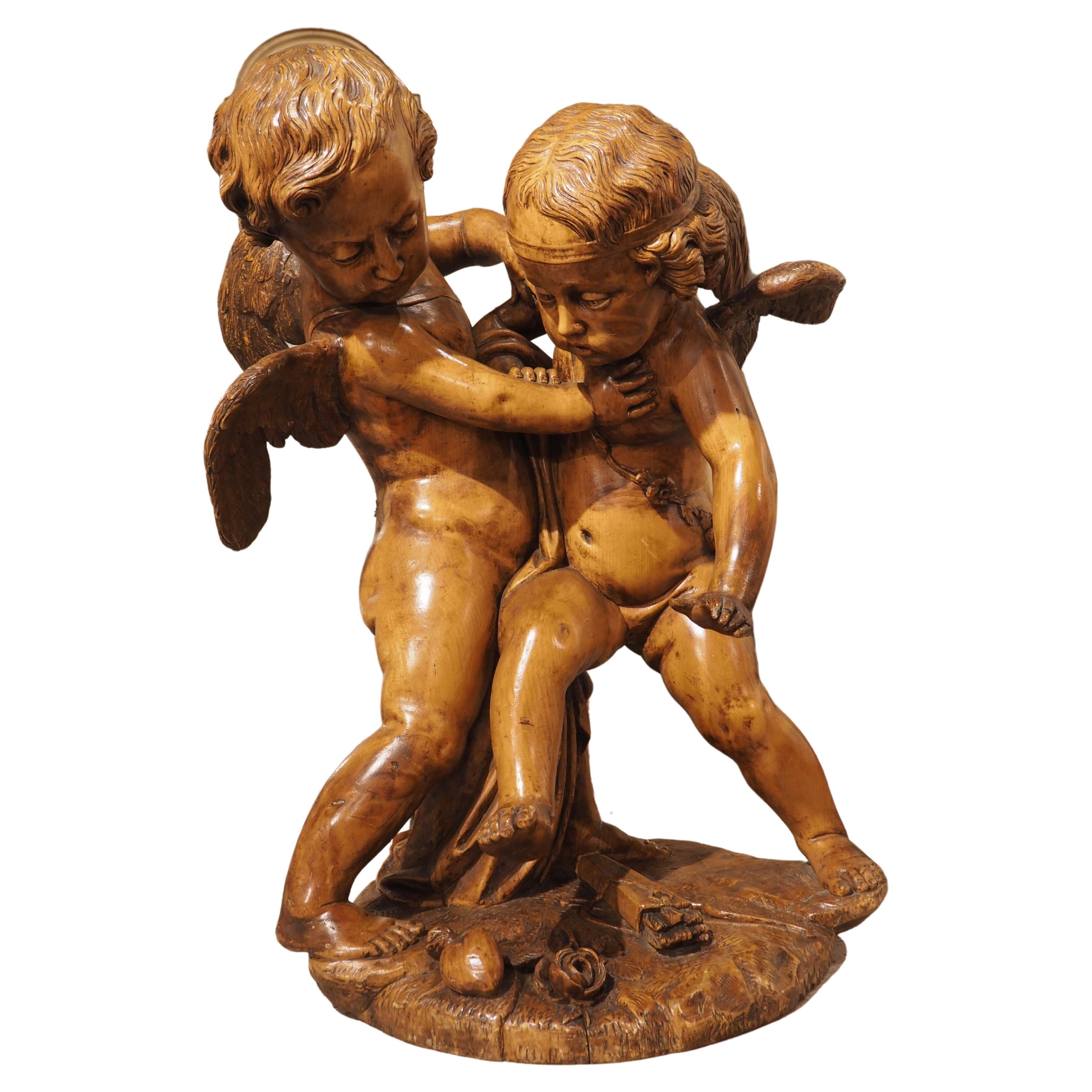 Sculpture française représentant deux cupidons se disputant un cœur, d'après E. Falconet, vers 1850 en vente