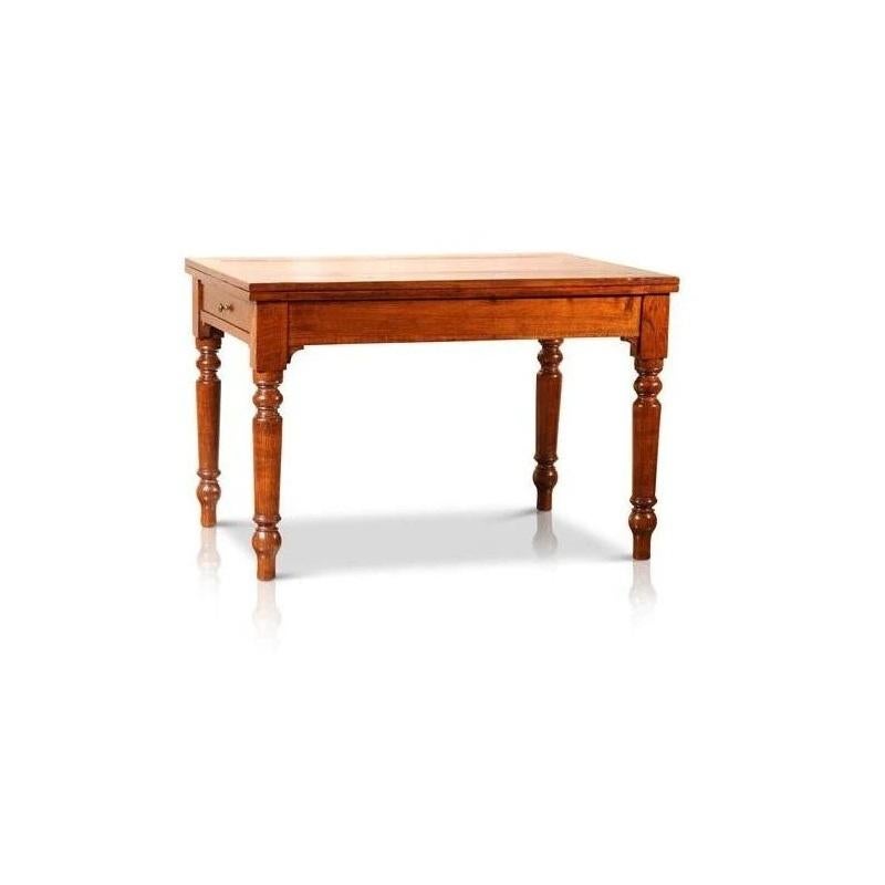 A rare piece to visit our gallery, this exquisite chestnut extendable table has been dated at approximately Circa 1850, and remains in perfect structural and functional condition. Found in Italy, this lovely piece features hand-carved, columned legs