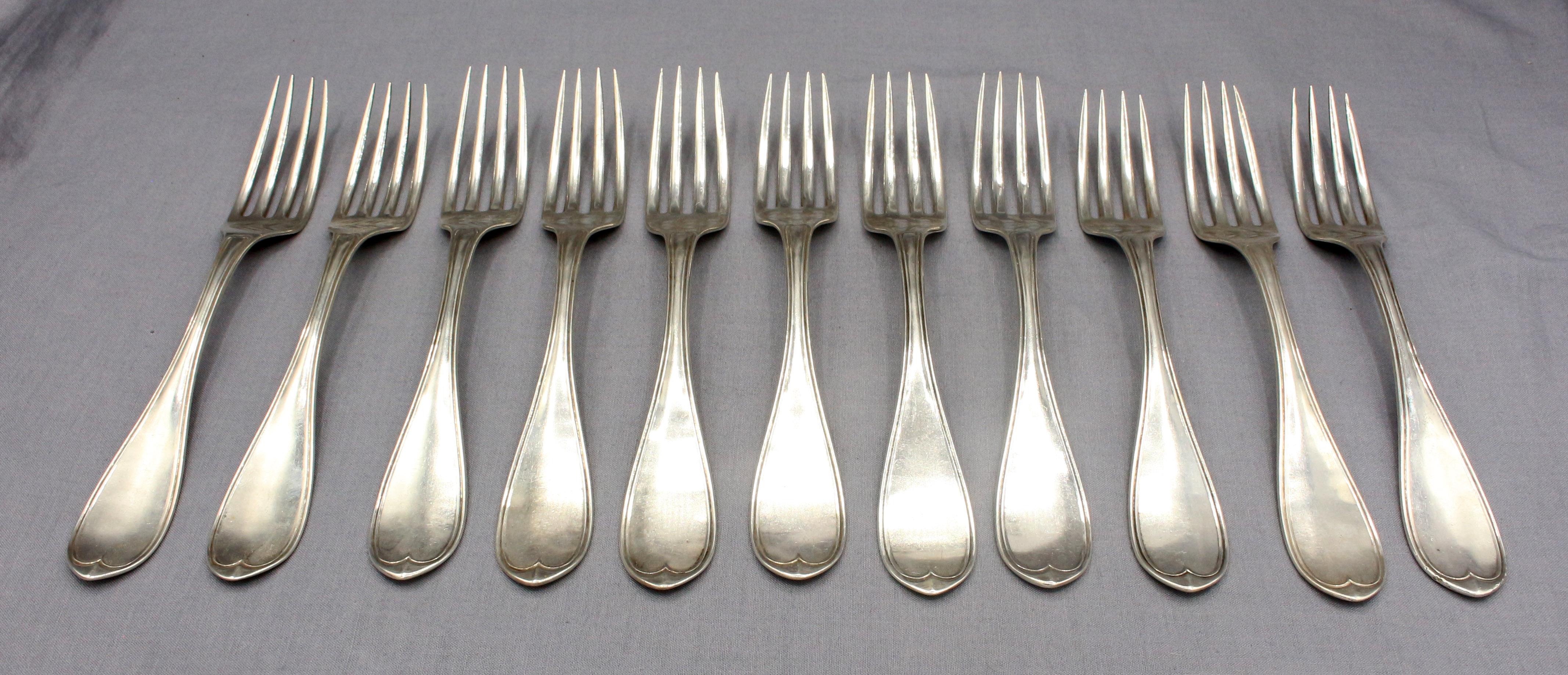 c.1850 Set of 11 coin silver dinner forks, Wood & Hughes, NY, NY. Pointed thread pattern. Reverse monogram. 18.80 troy oz.
7 3/4
