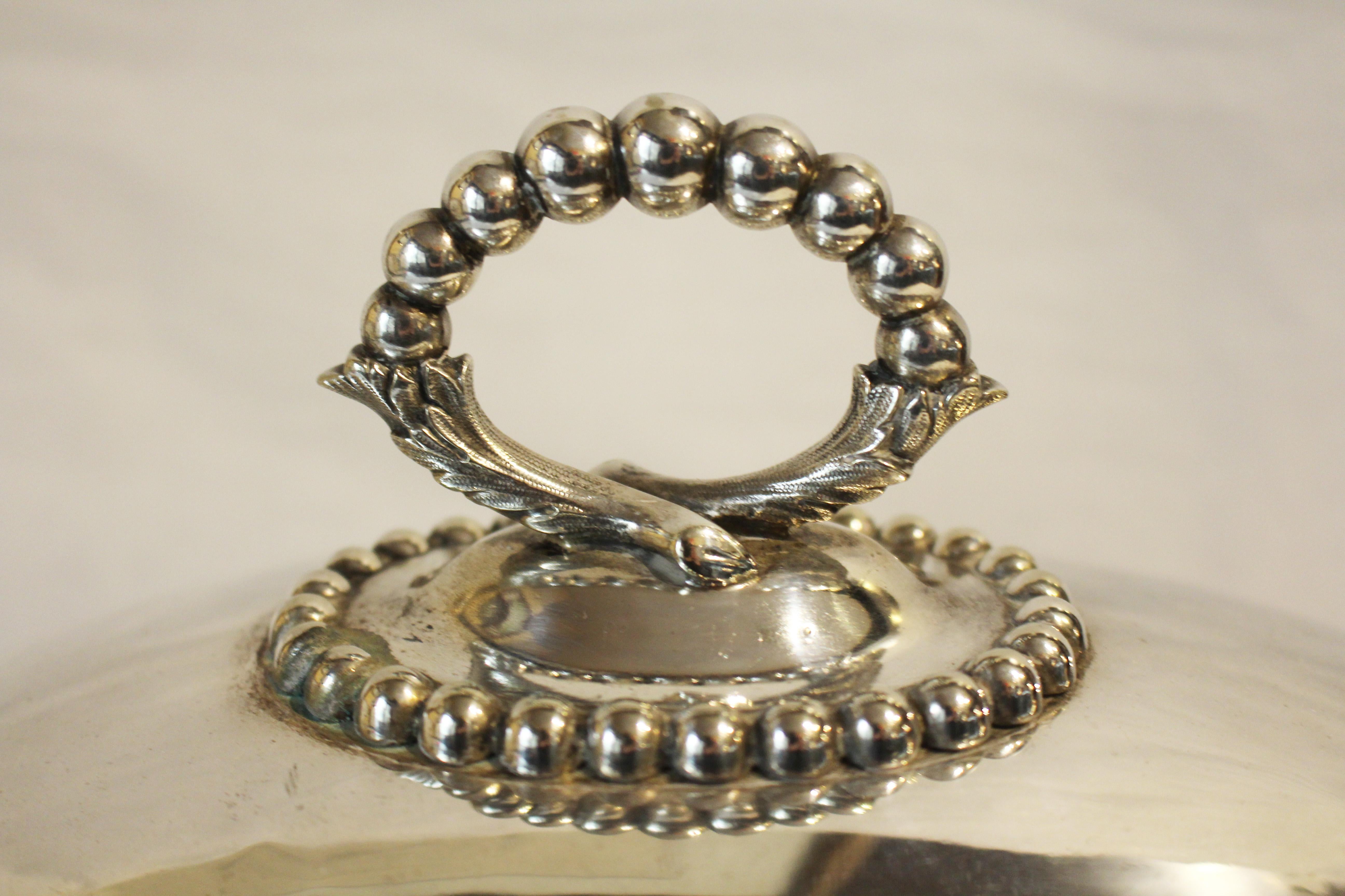 Circa 1850s James Dixon & Sons silver plated meat dome with bold beaded border. Raised by hand. Fully hallmarked. Minor blemishes reveal nickle silver base metal.
Measures: 14