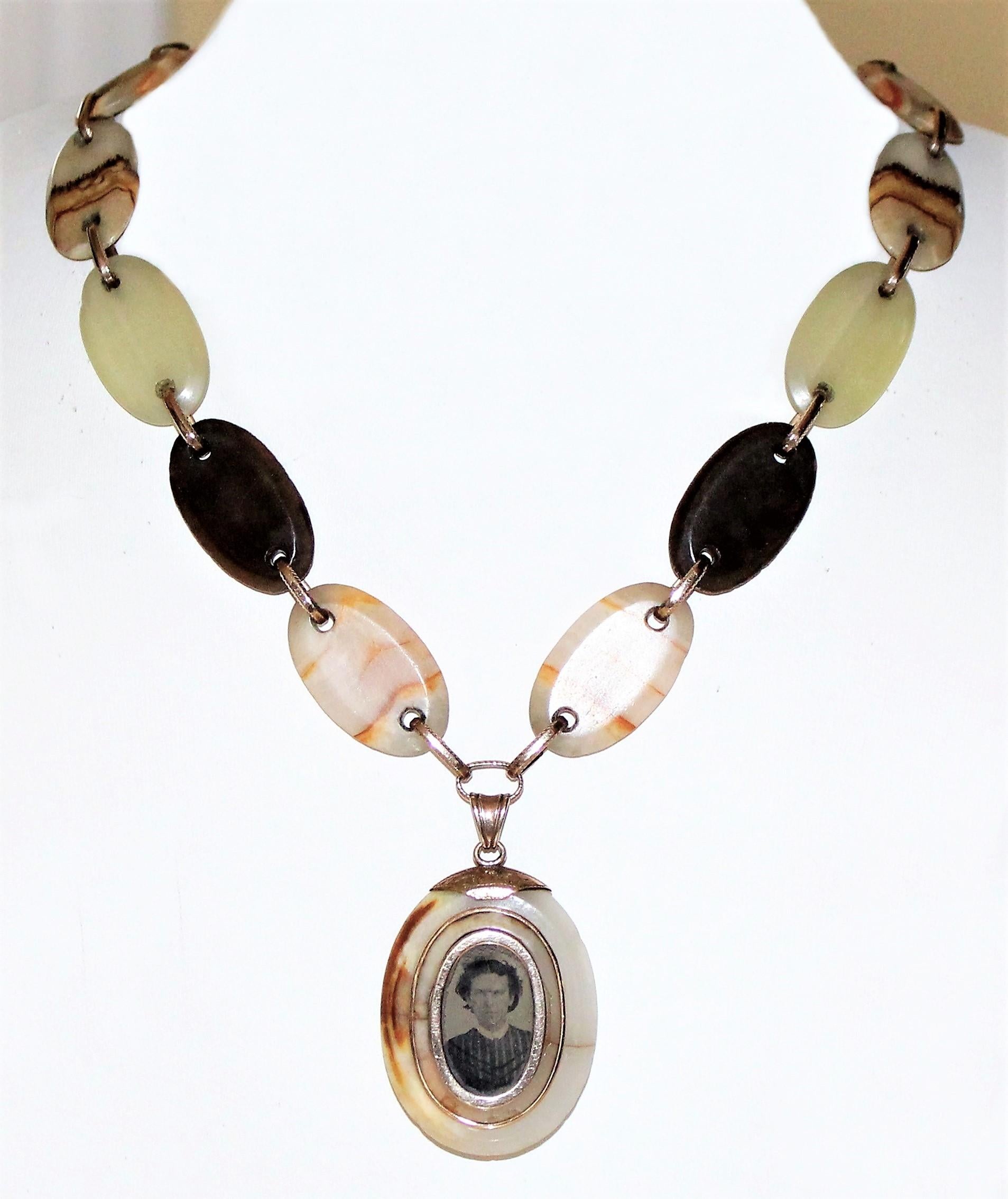 Circa 1850s Victorian multicolor oval agate link necklace and locket with heavy 14K rolled-gold links, findings, and shield-shape cartouche.  The necklace measures 18