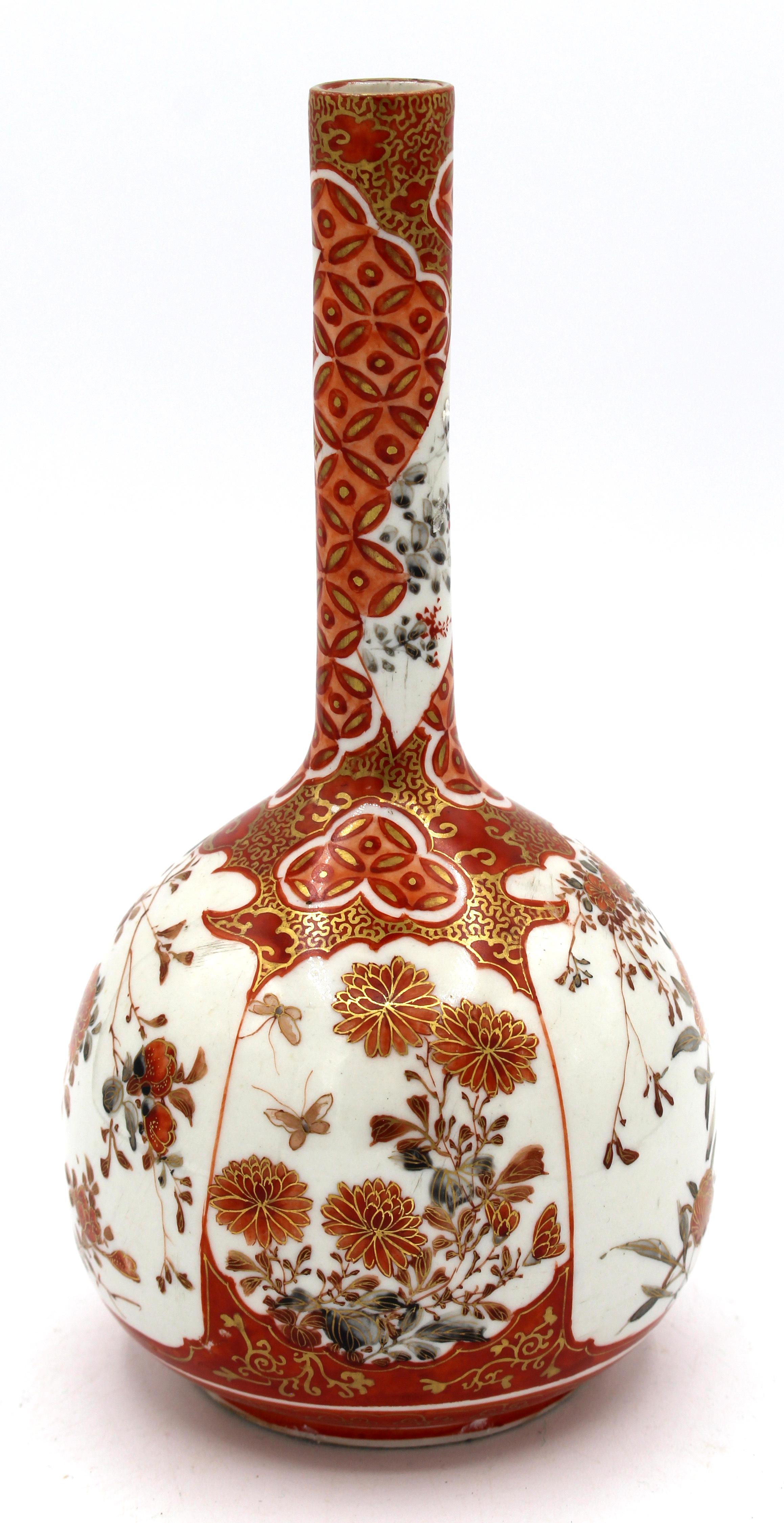 Circa 1860-80 bottle form Kutani vase, Japanese. Bittersweet orange & gilt floral reserves & extensive diapered shoulder & neck.
7.75