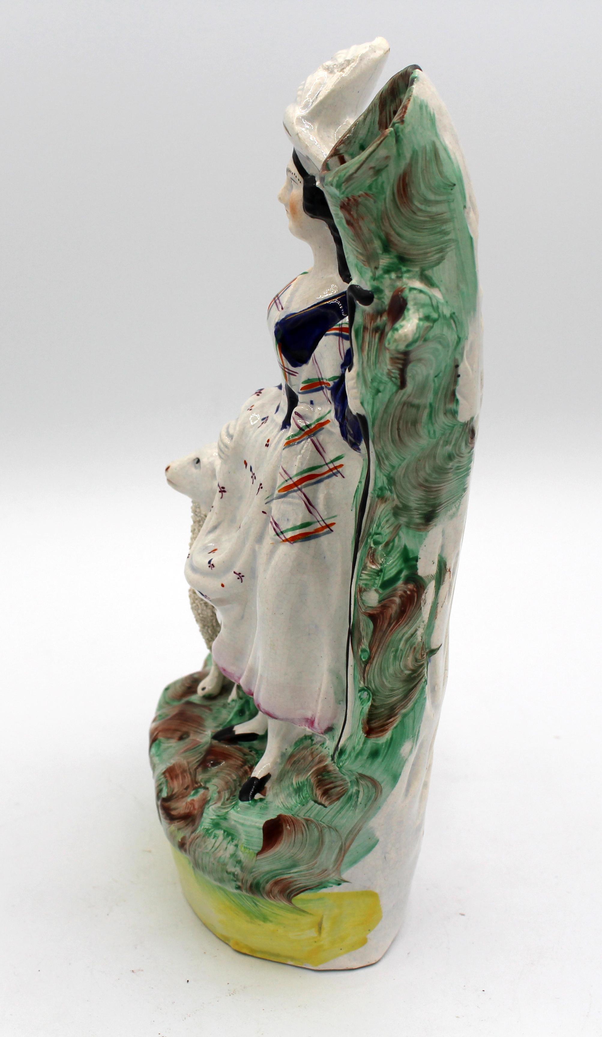circa 1860-80 English Staffordshire spill vase, a shepherdess. Note the gentle crazing & blue tones in crevices of her dress. Possible lip restoration.
6