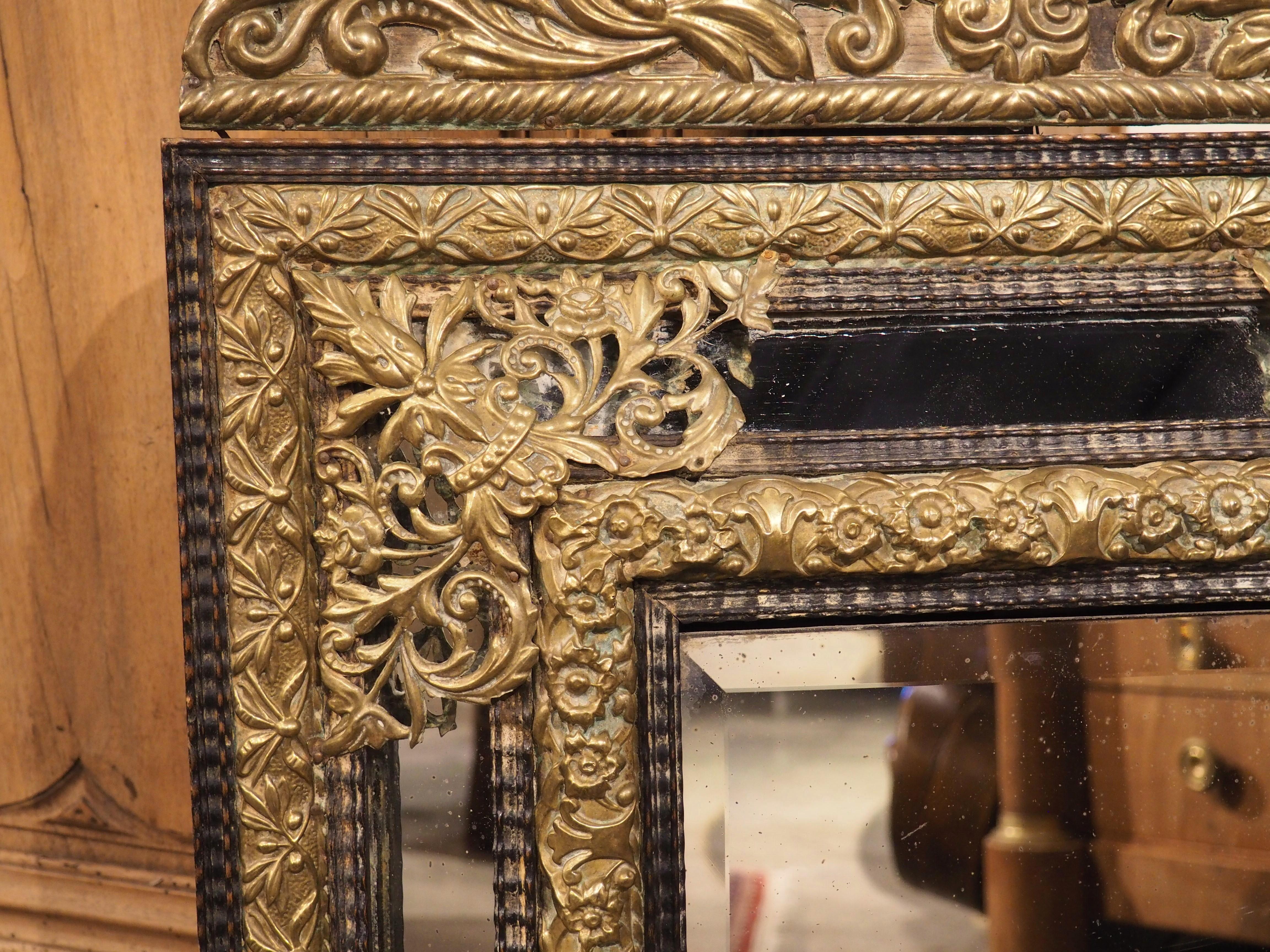 Hand-Carved Circa 1860 Ebonized and Brass Repousse Louis XIV Style Parclose Mirror For Sale