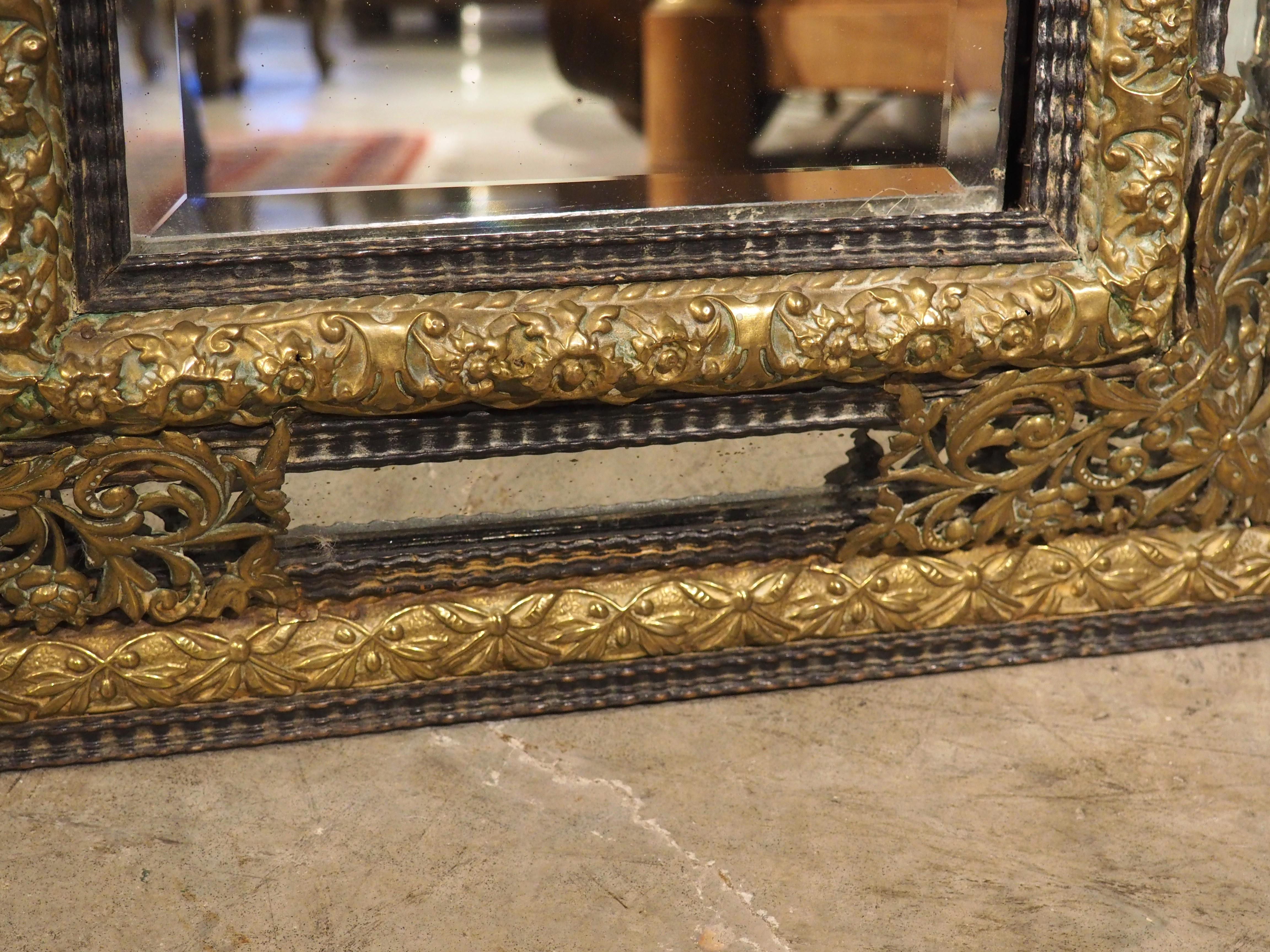 19th Century Circa 1860 Ebonized and Brass Repousse Louis XIV Style Parclose Mirror For Sale